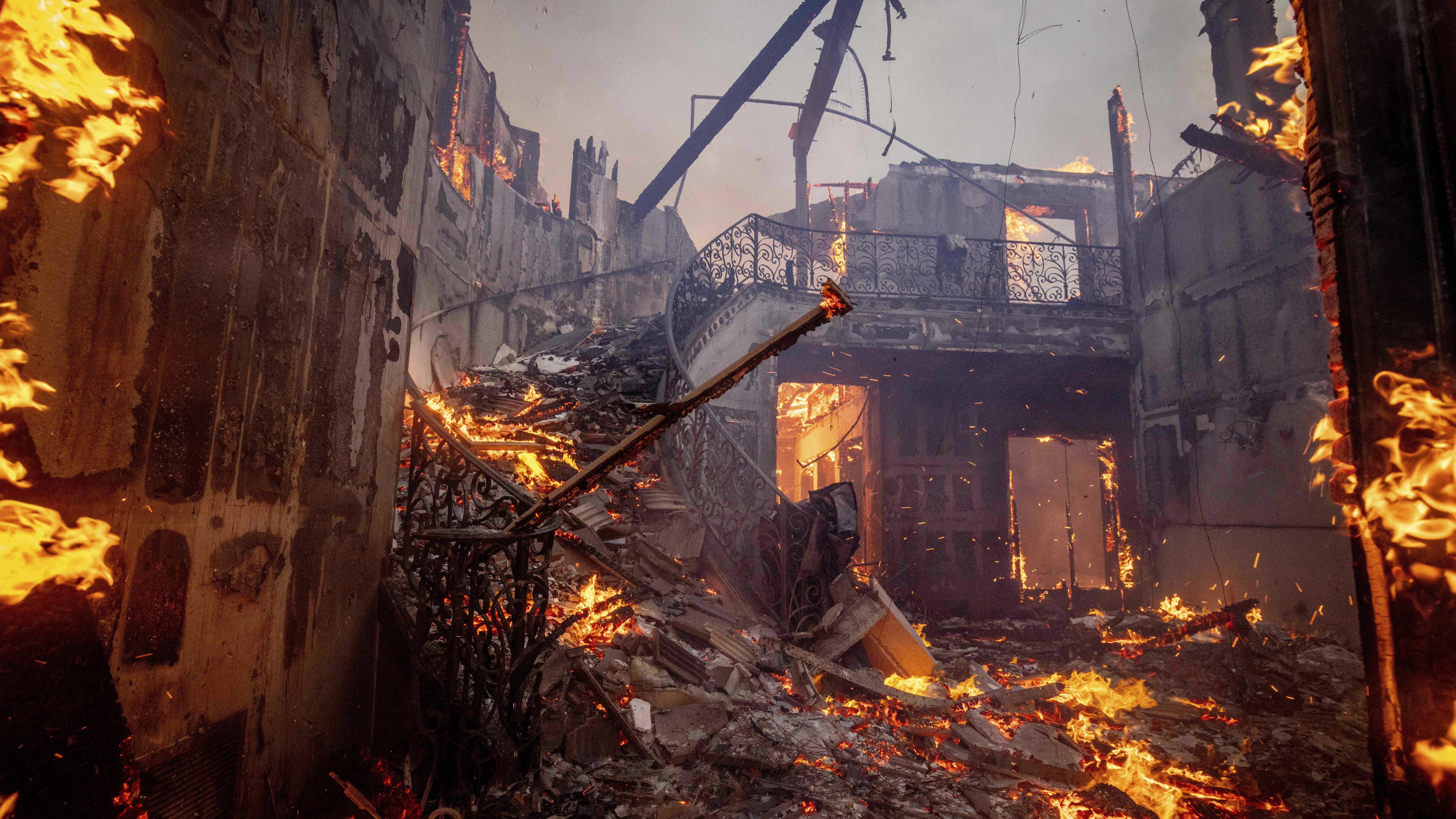 The Palisades Fire burns a residence in the Pacific Palisades neighbourhood of Los Angeles.