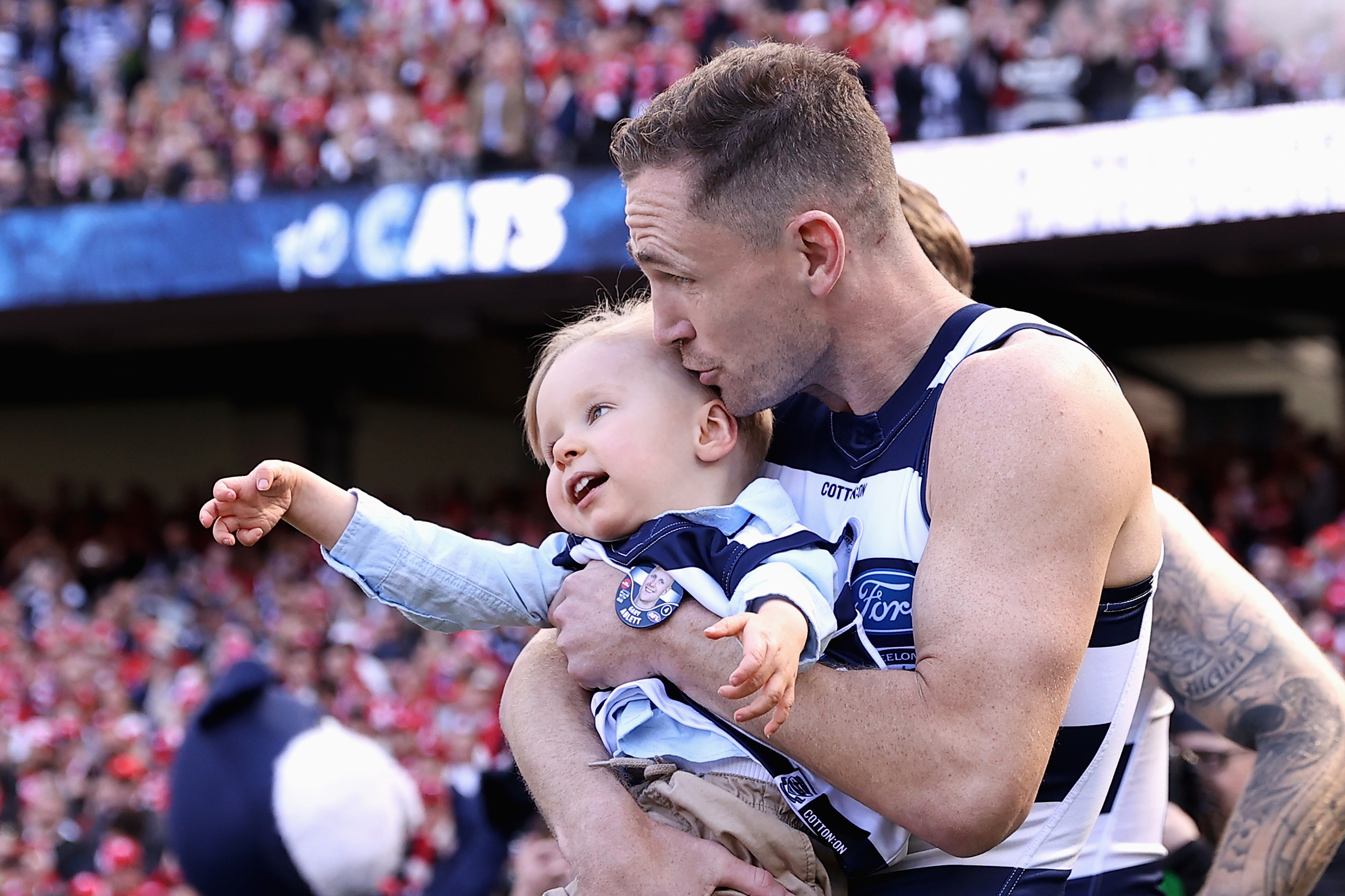 Joel Selwood of the Cats and Levi Ablett enter the field during the 2022 AFL Grand Final match between the Geelong Cats and the Sydney Swans at the Melbourne Cricket Ground on September 24, 2022 in Melbourne, Australia. (Photo by Cameron Spencer/AFL Photos/via Getty Images)
