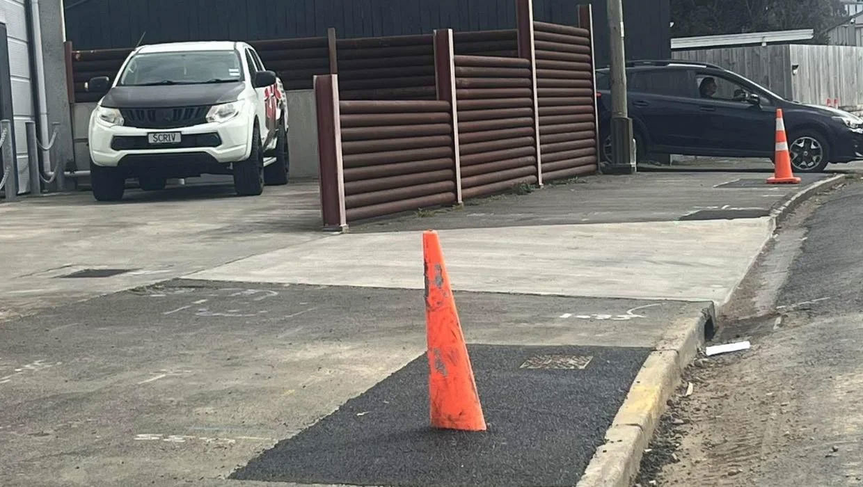 Yes, it's a road cone asphalted into the footpath, deliberately, by the council.