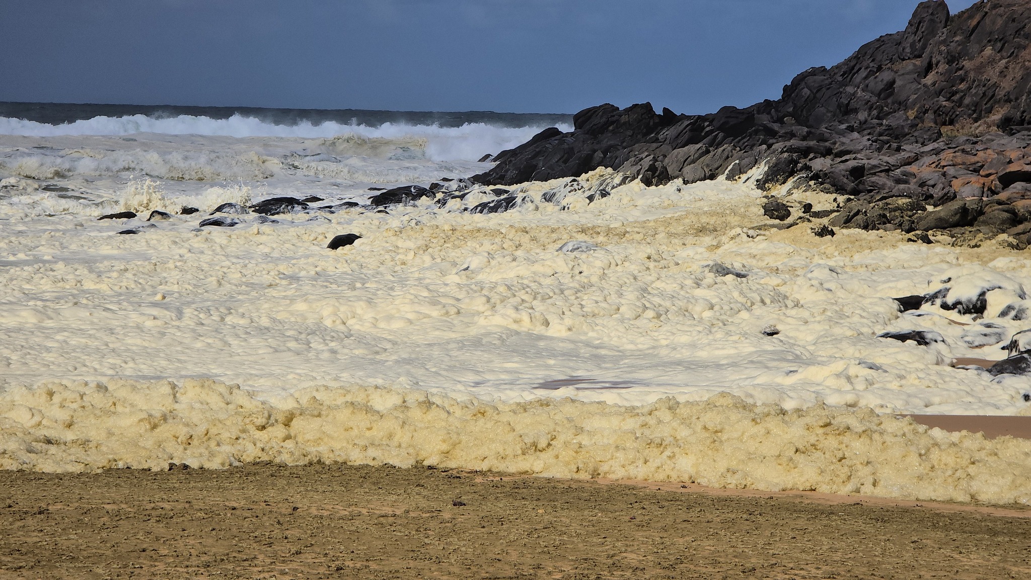 A multi-agency investigation is underway after masses of yellow foam washed up on a popular South Australian beach, leaving surfers feeling sick and infected. ﻿