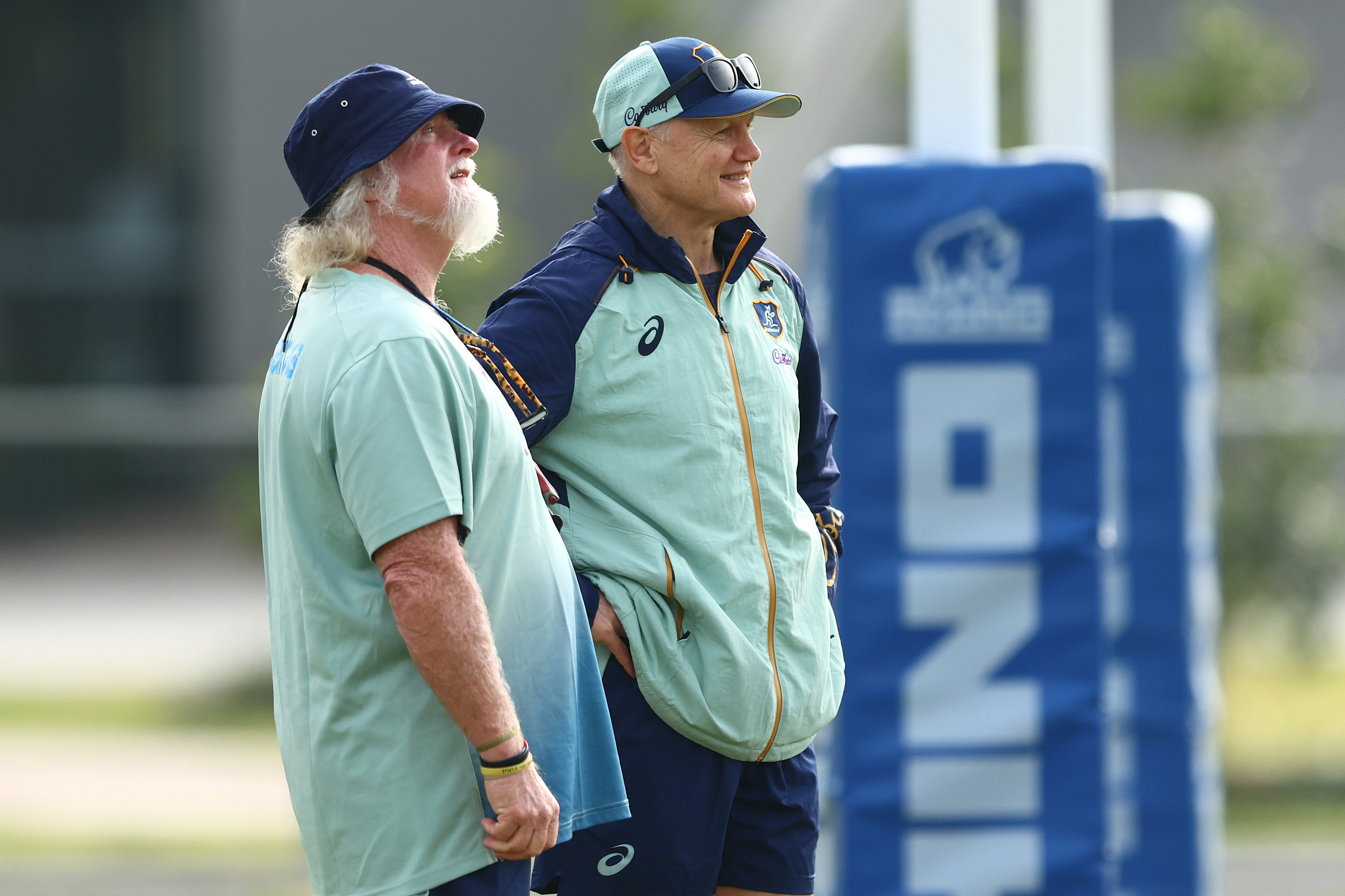 Joe Schmidt and Laurie Fisher talk during a Wallabies training session at Ballymore Stadium.