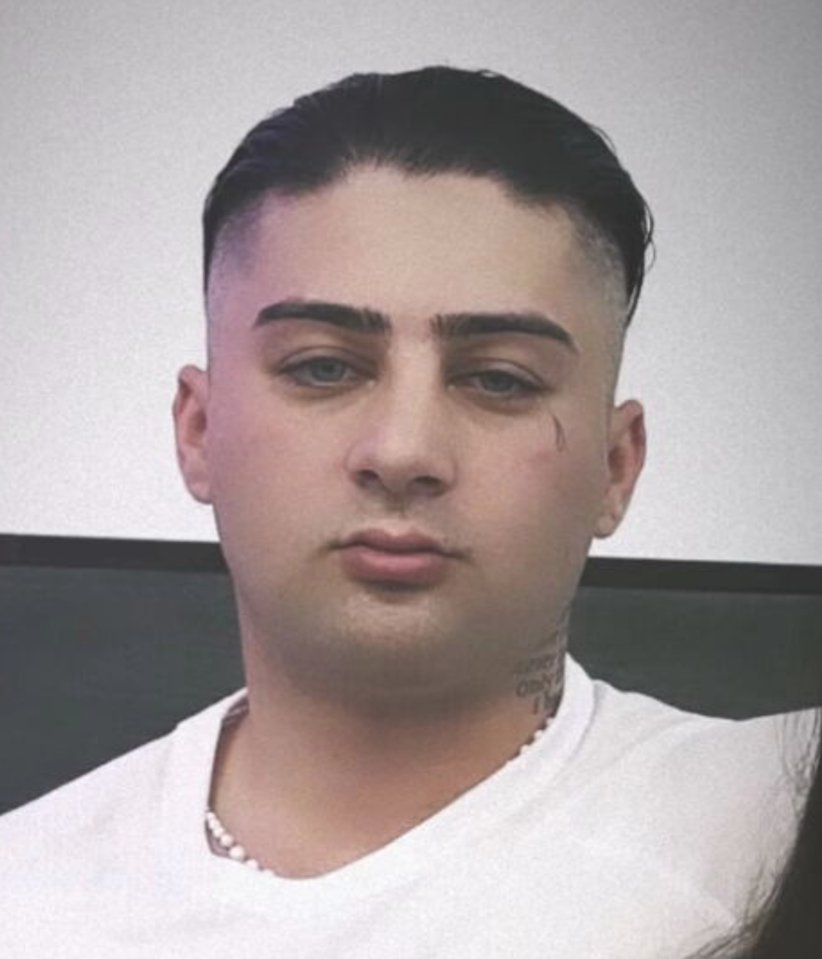 The 21-year-old was ambushed in an execution-style shooting just metres from his family home.