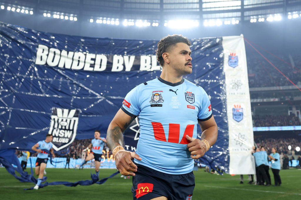 Latrell Mitchell runs onto the field.