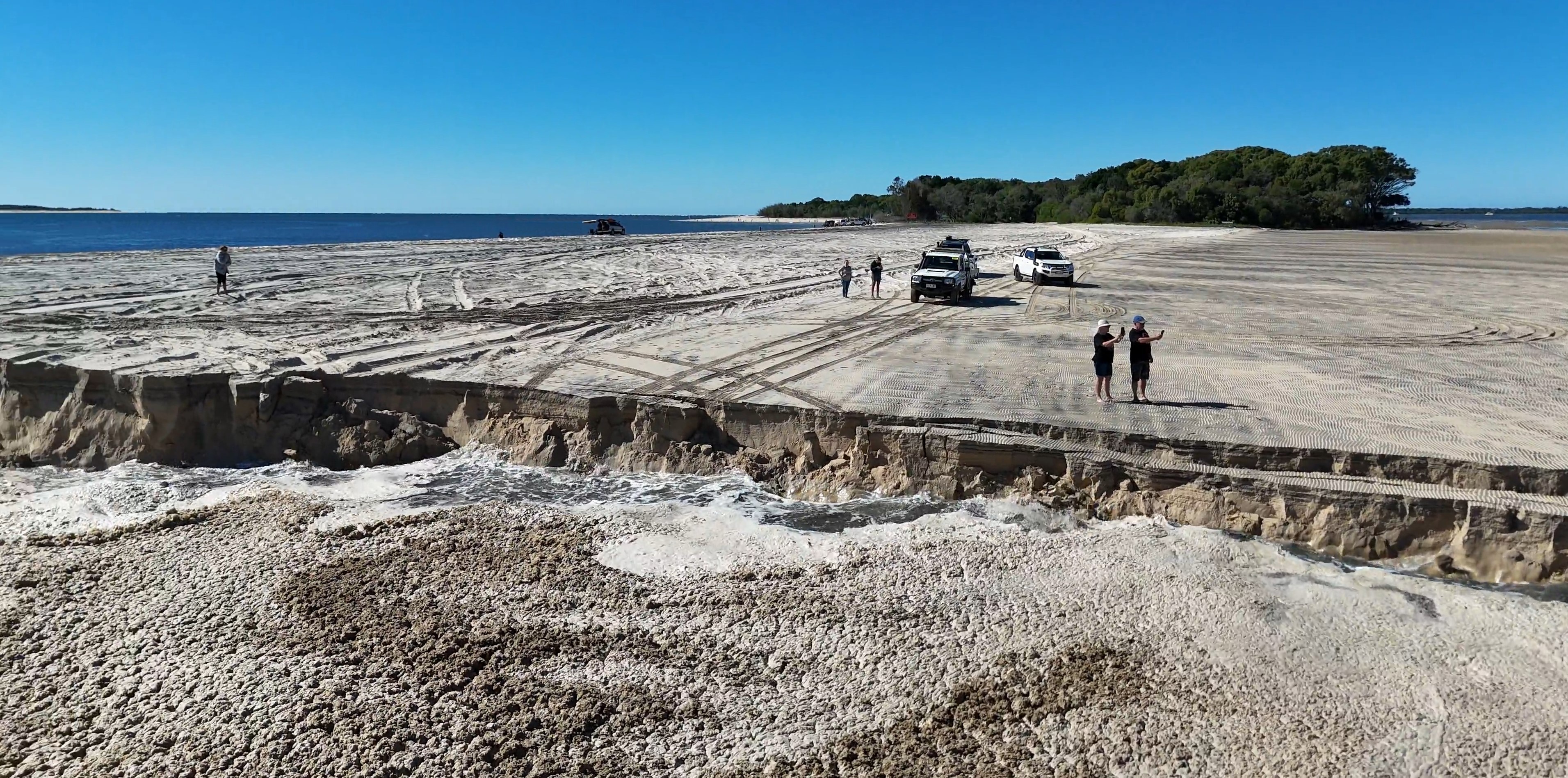 A sinkhole has opened up at Inskip Point north of Rainbow Beach in Queensland. 