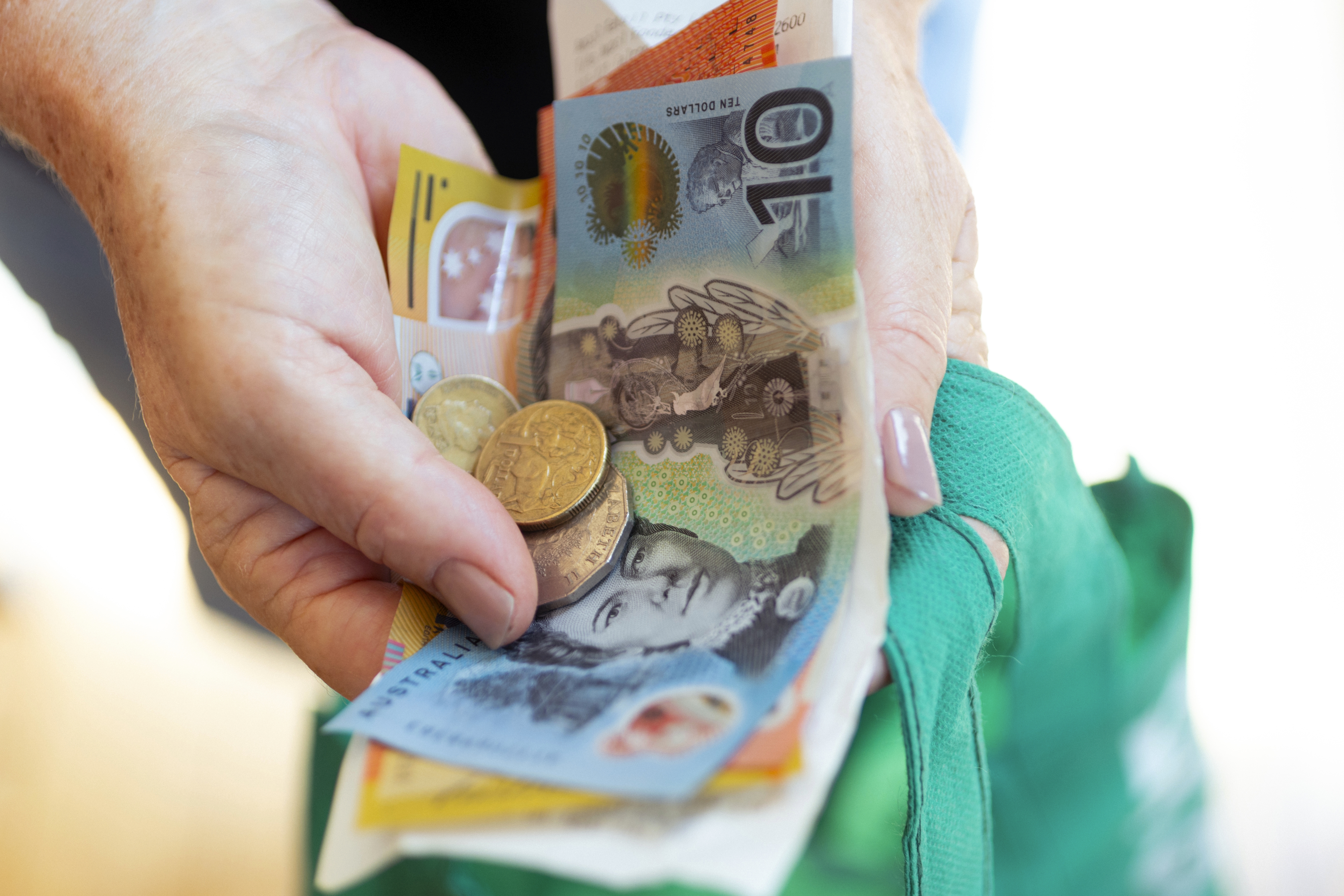 GEN23, Generic, cash payments, shopping, cost of living,  wages, withdrawal, atm, armaguard, groceries, in Sydney on April 1, 2024. 