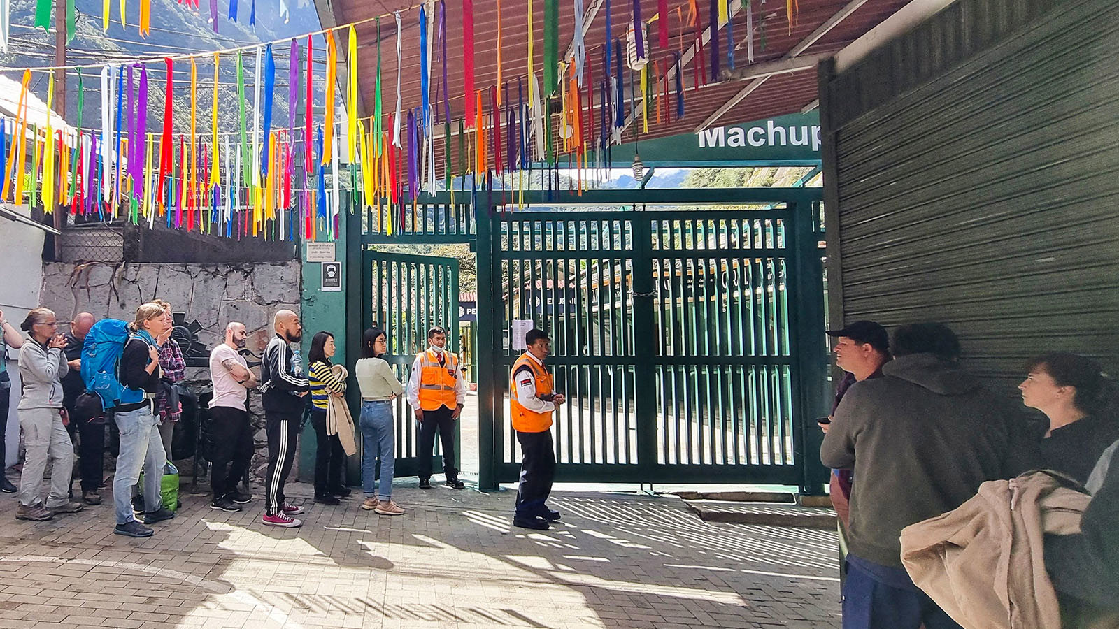 Stranded tourists queue at the train terminal in Machu Picchu
