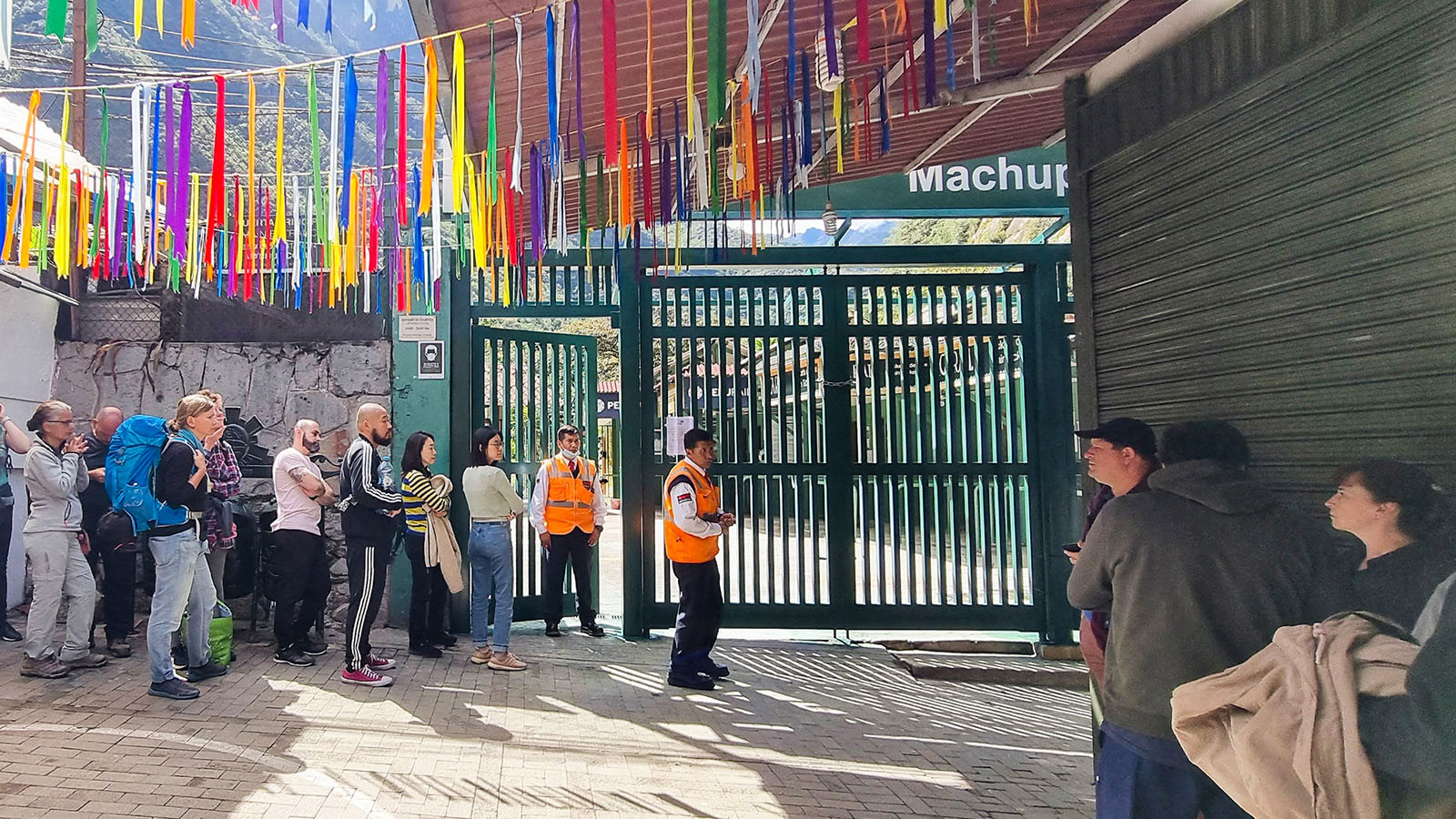 Stranded tourists queue at the train terminal in Machu Picchu