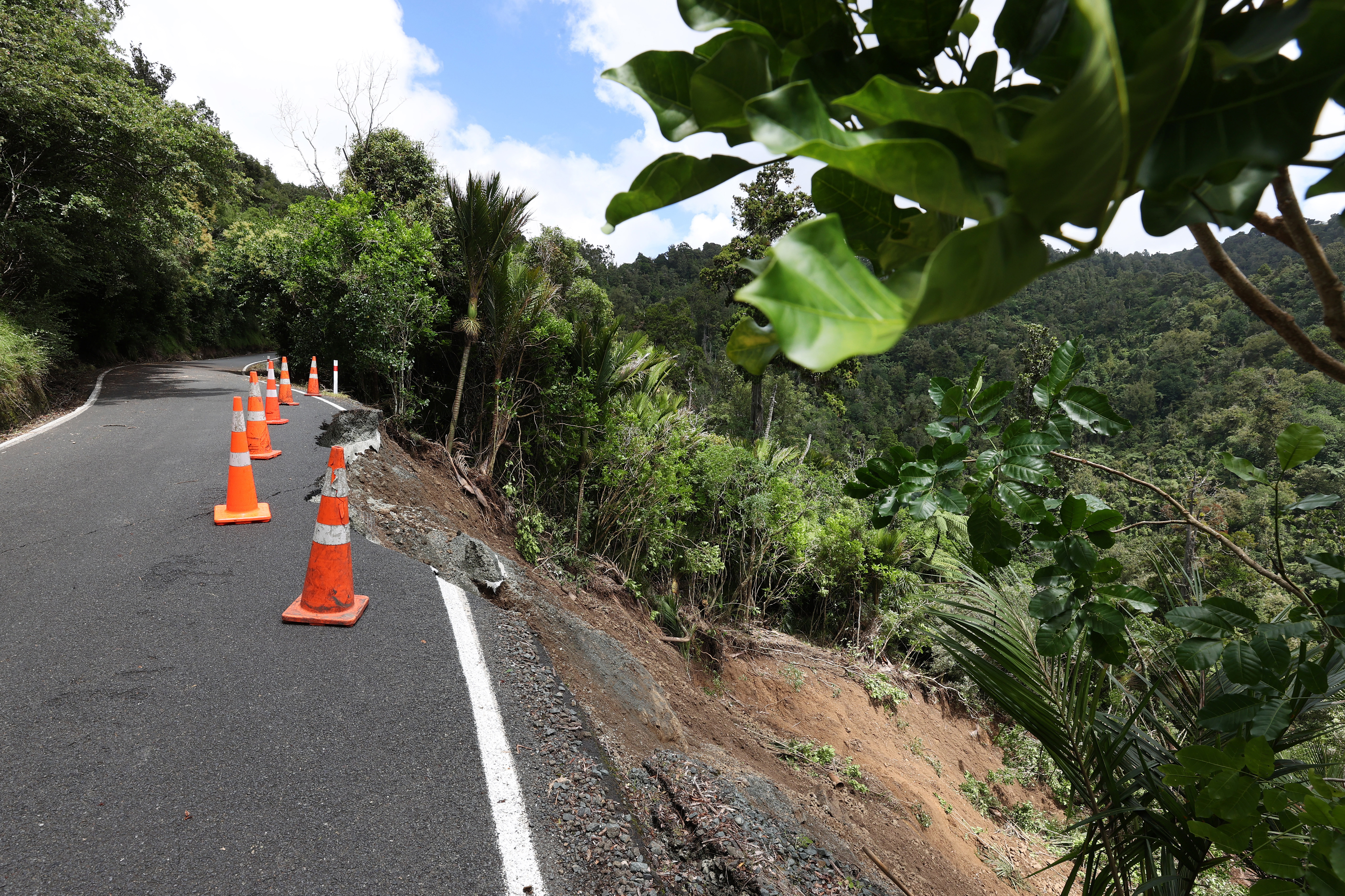 One of many huge slips on Mountain Rd, one of two access roads in Henderson Valley into Piha on February 14, 2023 in Auckland, New Zealand. New Zealand has declared a national state of emergency with flooding and landslides devastating several communities. (Photo by Fiona Goodall/Getty Images)