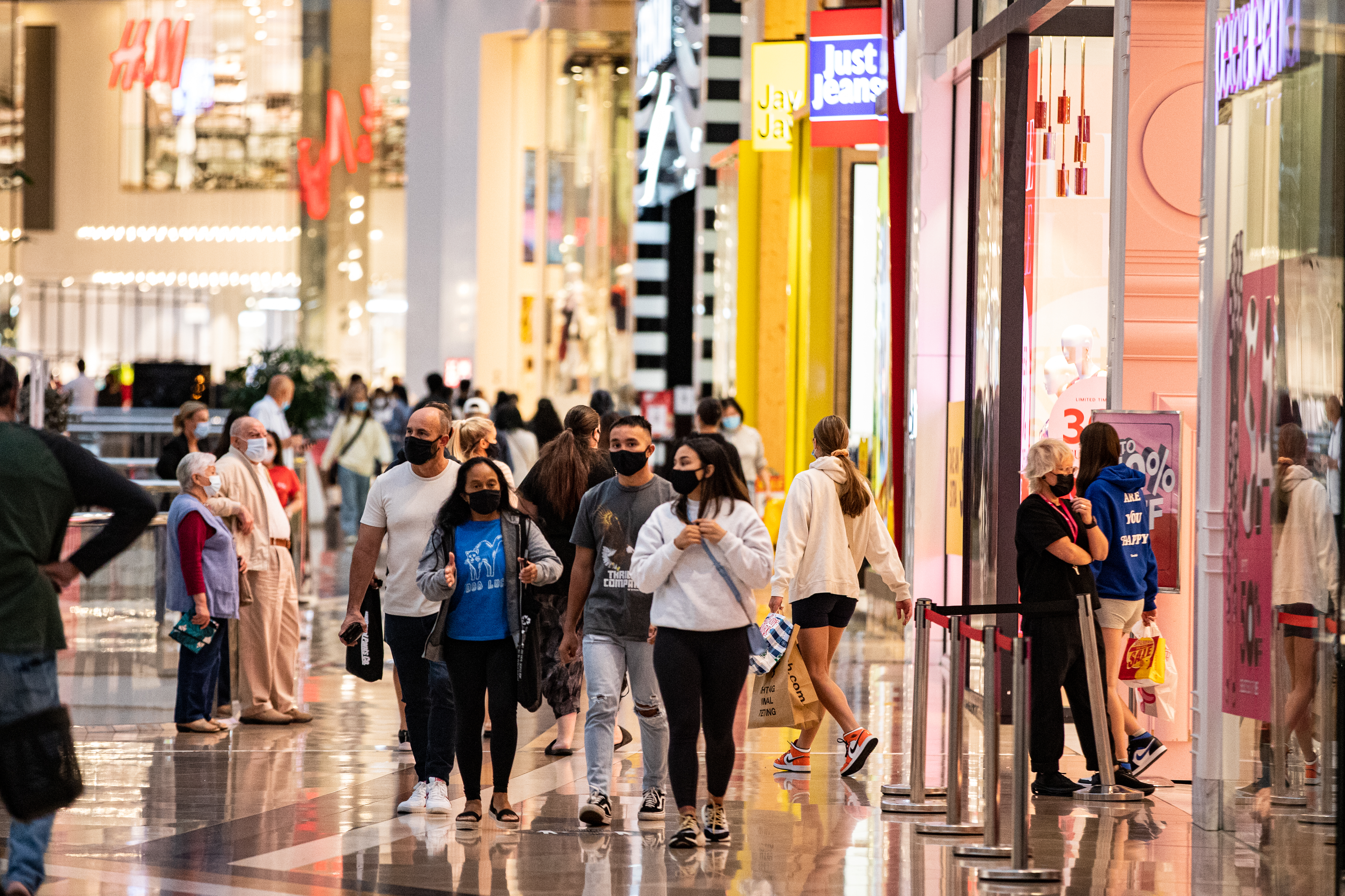 MELBOURNE, AUSTRALIA - DECEMBER 26: Early risers line up outside a store to catch the Boxing Day sales at Chadstone the Fashion Capital  during the Boxing Day sales on December 26, 2021 in Melbourne, Australia. Australians celebrate Boxing Day with many taking advantage of the post-Christmas sale prices in what is usually the busiest day of the year for retailers in Australia. In Sydney, thousands of people usually gather around and on the harbour to watch the start of the Sydney to Hobart yacht