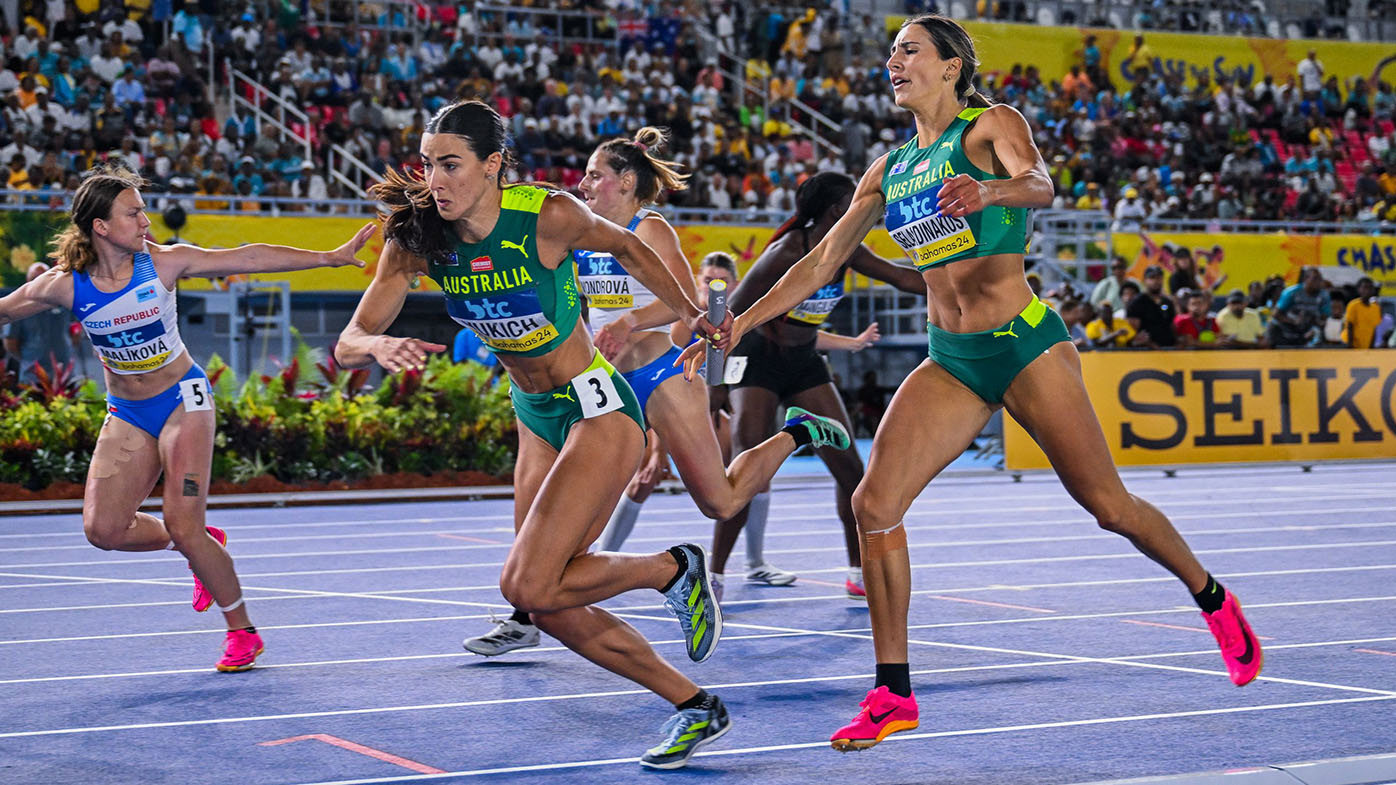 Alanah Yukich receives the baton from Mikeala Selaidinakos at the World Athletics Relays in The Bahamas.