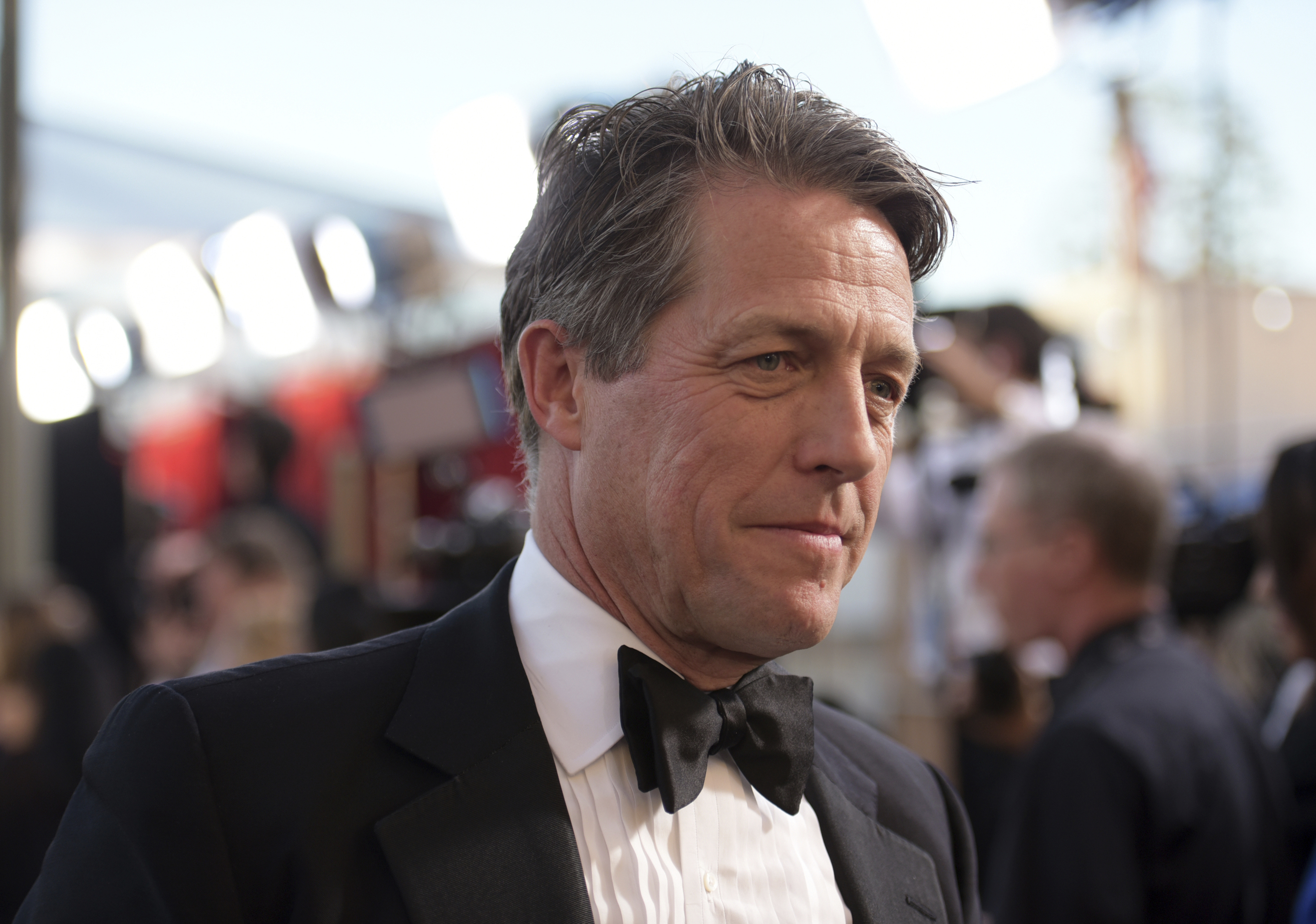 Hugh Grant arrives at the 23rd annual Screen Actors Guild Awards at the Shrine Auditorium & Expo Hall in Los Angeles, Sunday Jan. 29, 2023.