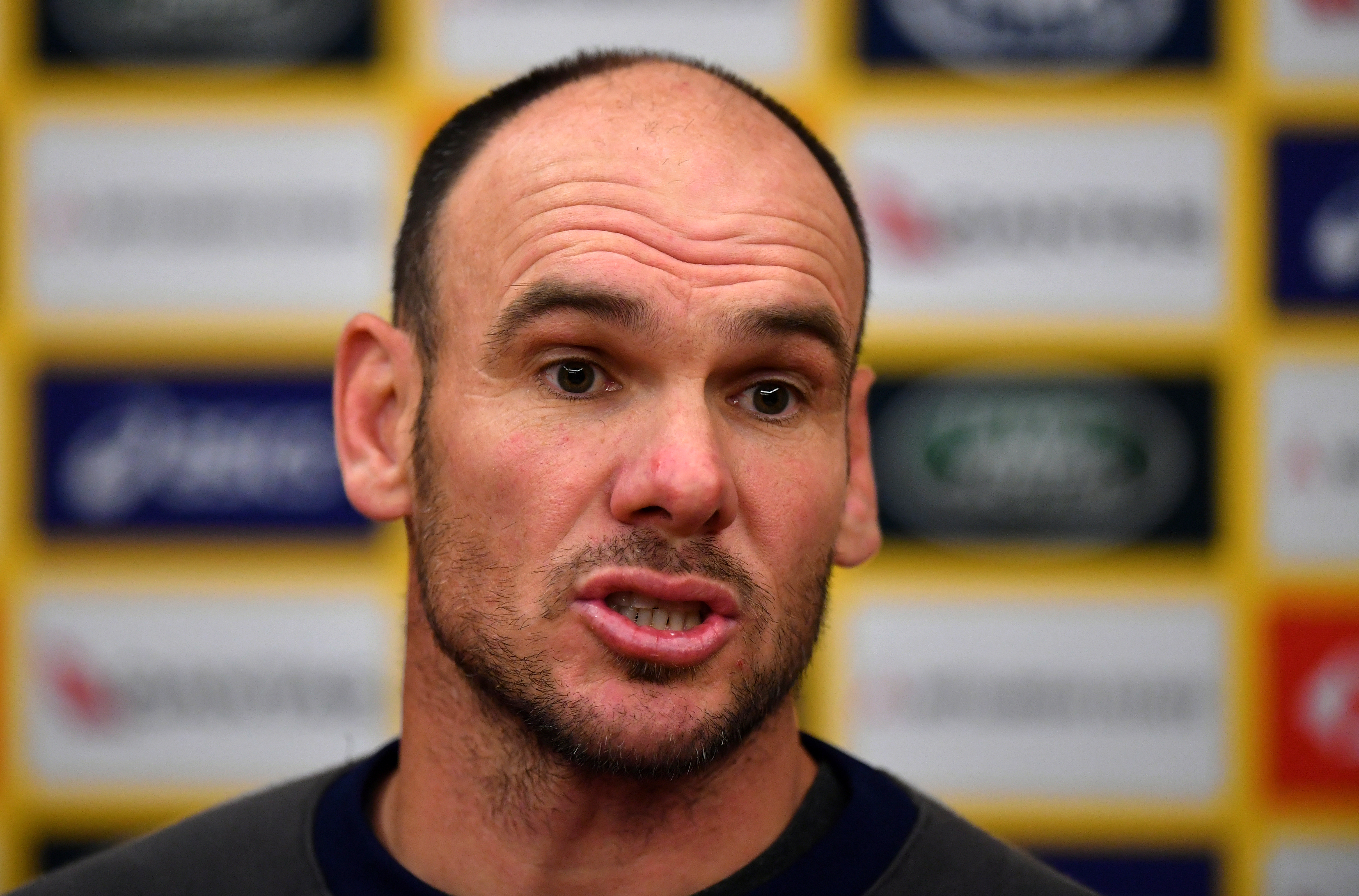 Nathan Grey faces the media during a press conference.