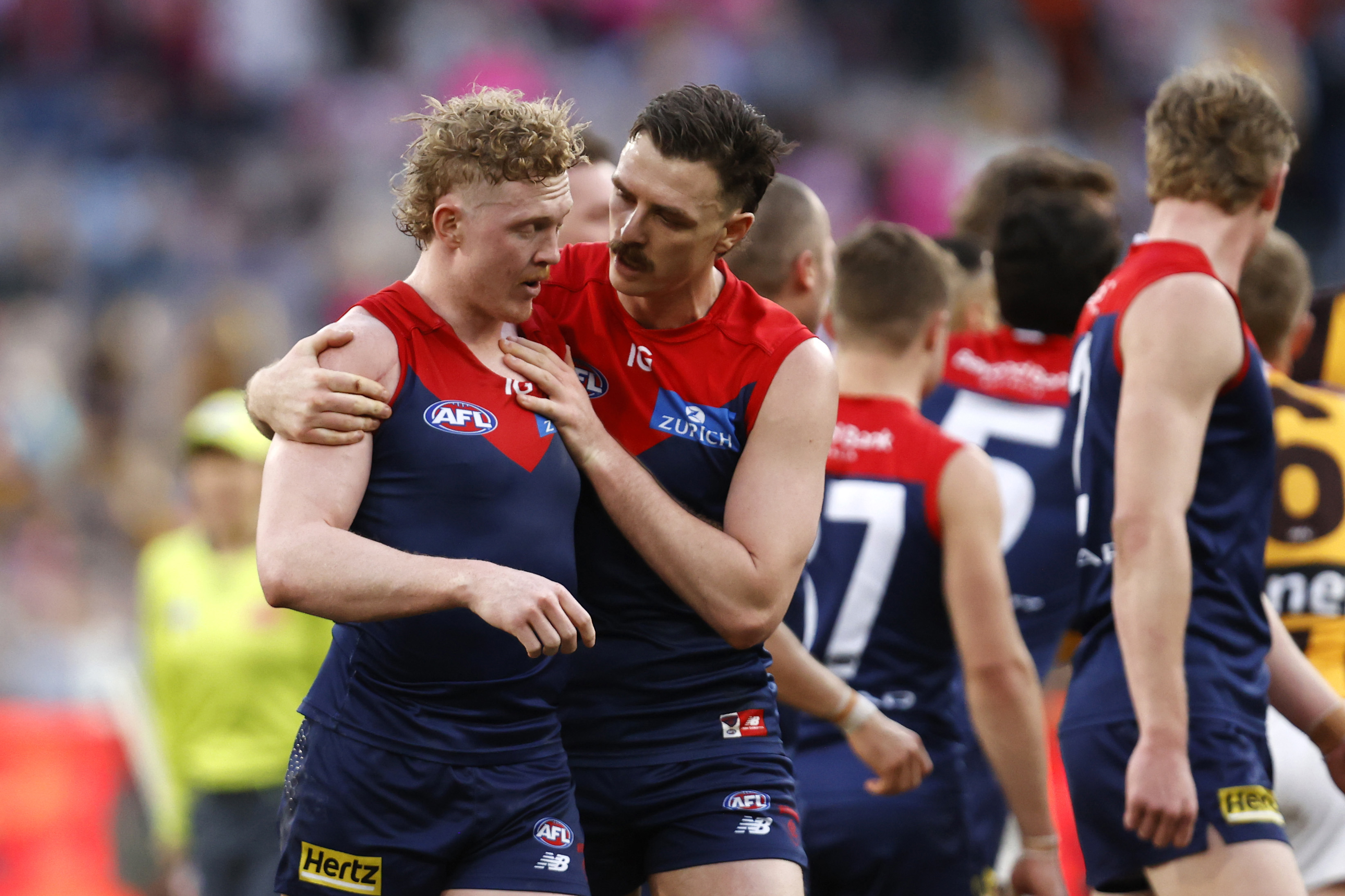 MELBOURNE, AUSTRALIA - AUGUST 20: Jake Lever of the Demons drags team mate Clayton Oliver of the Demons away from a wrestle during the round 23 AFL match between Melbourne Demons and Hawthorn Hawks at Melbourne Cricket Ground, on August 20, 2023, in Melbourne, Australia. (Photo by Darrian Traynor/Getty Images)