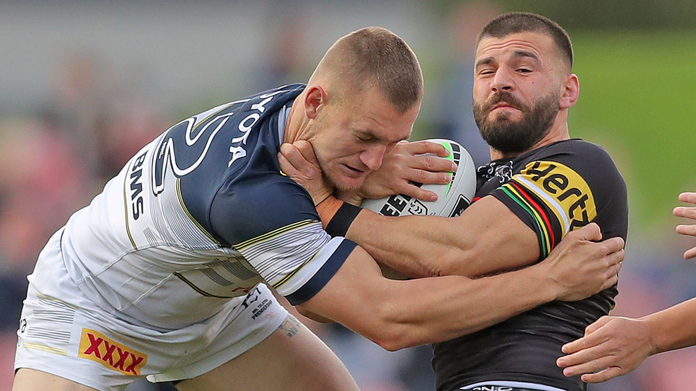 Josh Mansour of the Panthers is tackled 