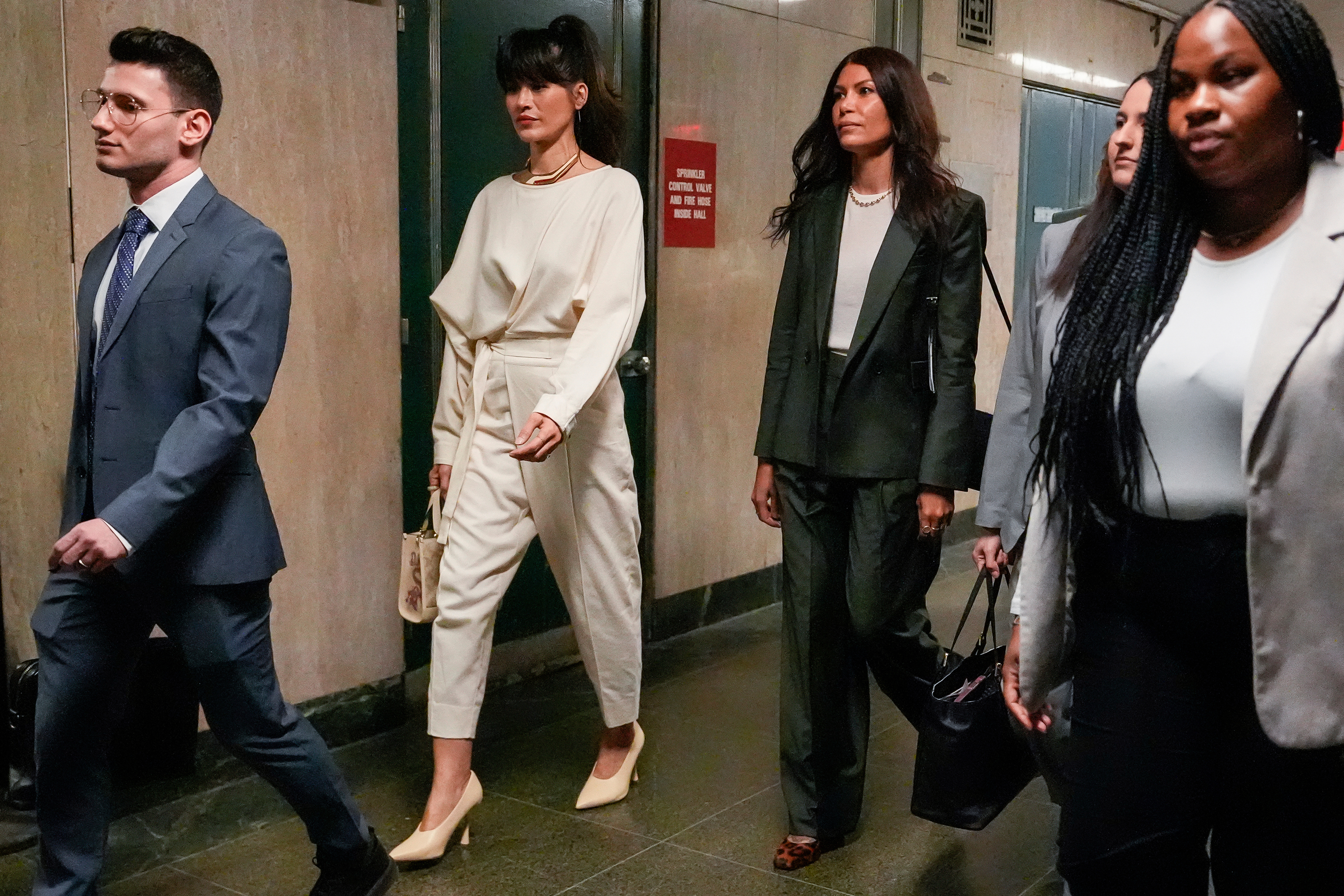Tarale Wulff, second from left, Dawn Dunning, third from left, and attorney Lindsay Goldbrum, second from right, arrive for Harvey Weinstein's retrial
