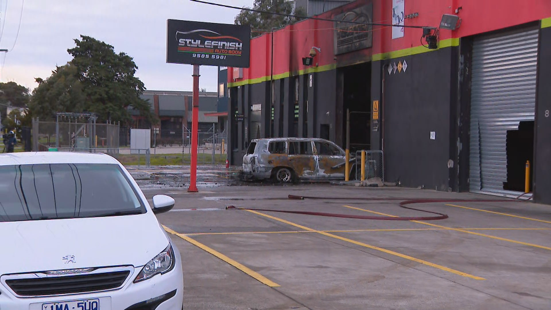 Fire rips through Melbourne business after car torched