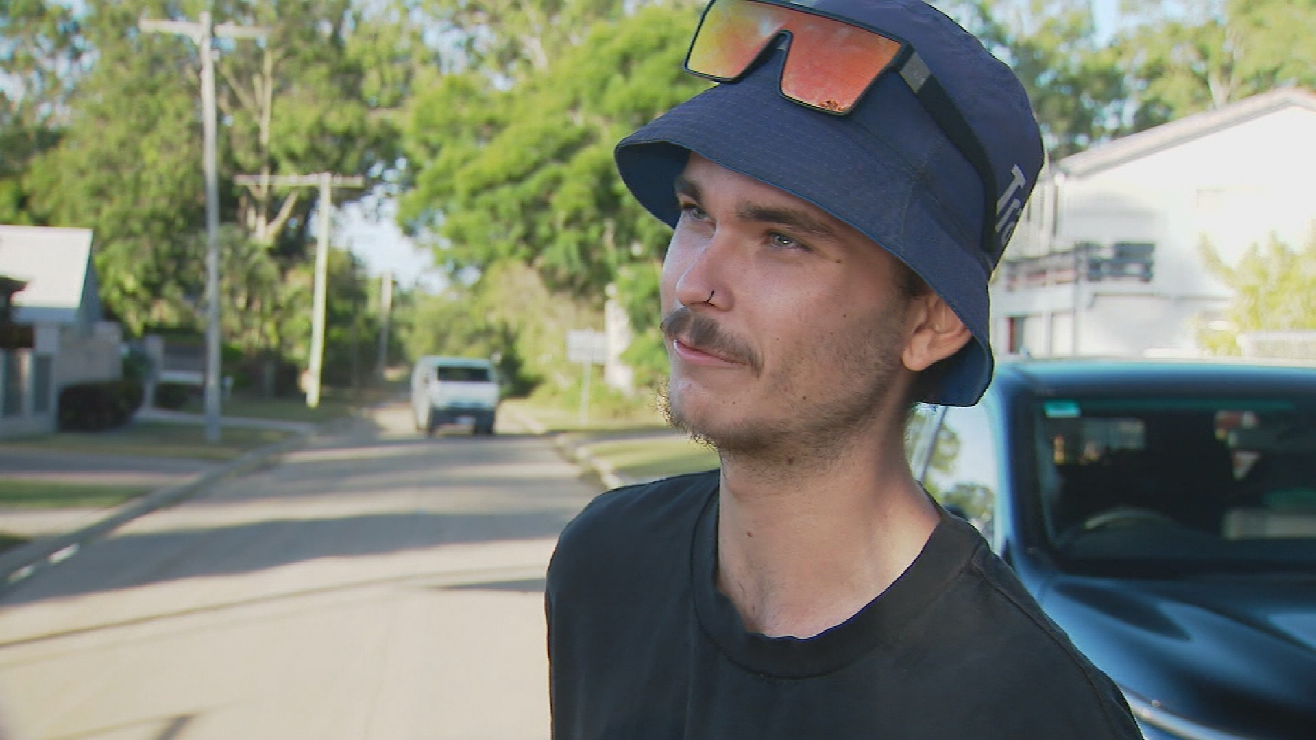 Two tradies have rescued an elderly man who became trapped in his car while it was being washed away by floodwaters in Queensland's Moreton Bay region.