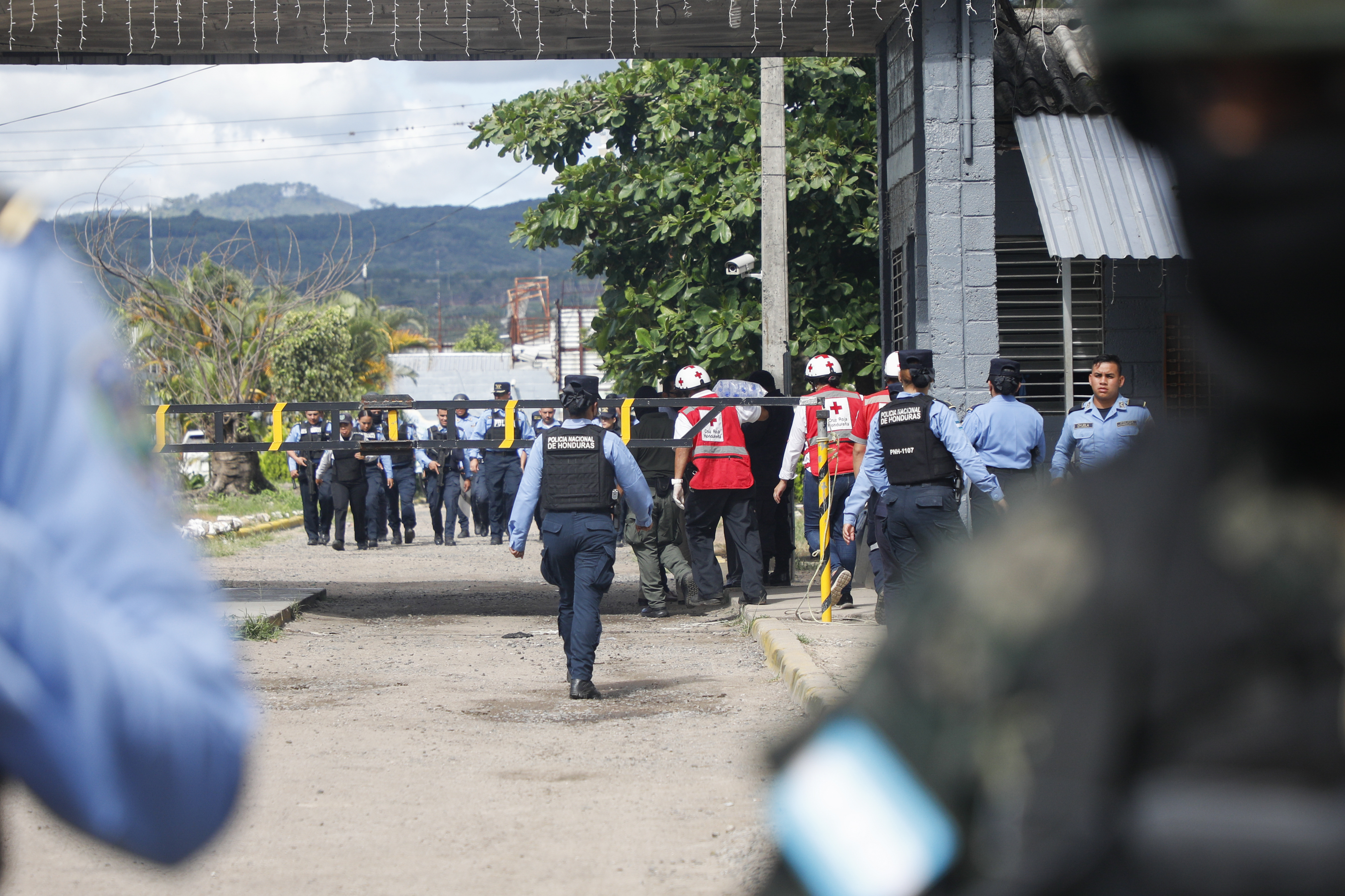 Police officers guard the entrance to the women's prison in Tamara, on the outskirts of Tegucigalpa, Honduras, Tuesday, June 20, 2023. 