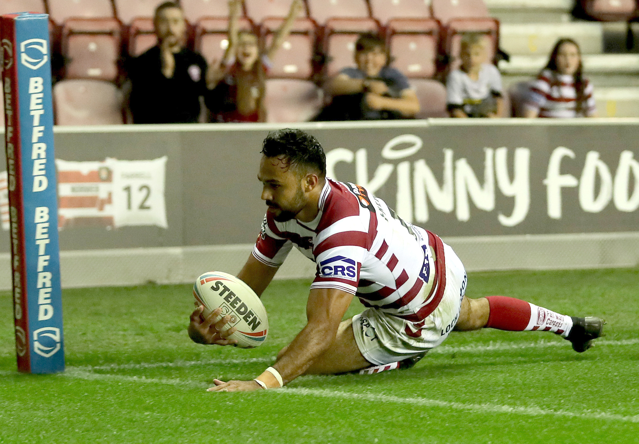 Wigan warriors Bevan French scores his third try during the Betfred Super League match at the DW Stadium, Wigan. Picture date: Thursday July 28, 2022. (Photo by Richard Sellers/PA Images via Getty Images)