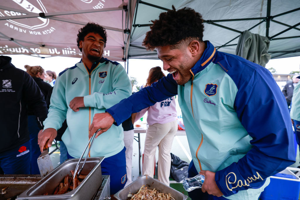 Isaac Kailea and Rob Valetini man the BBQ at Boronia Park.