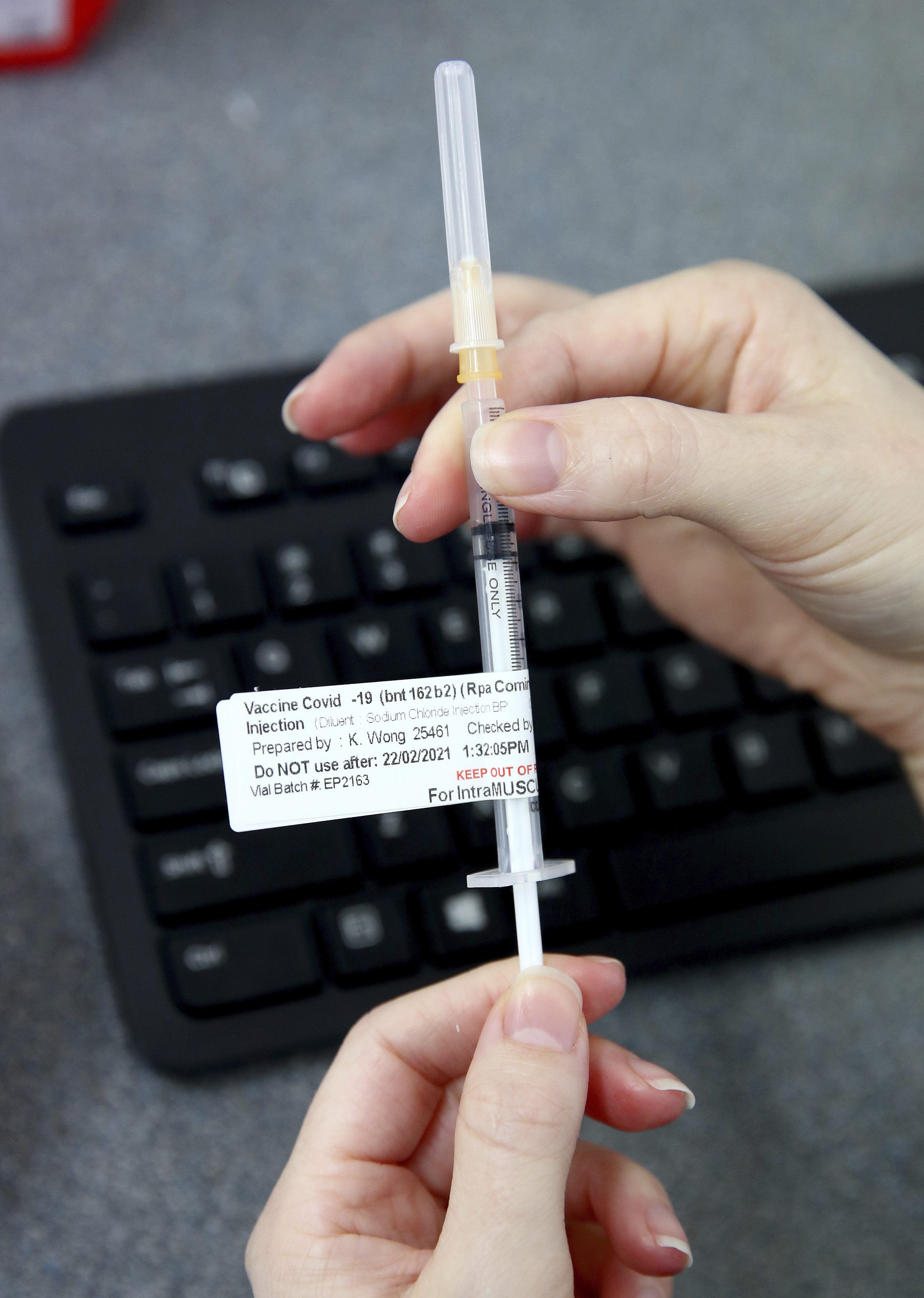 An investigation is under way after a woman was given a COVID-19 vaccination with a used needle. 