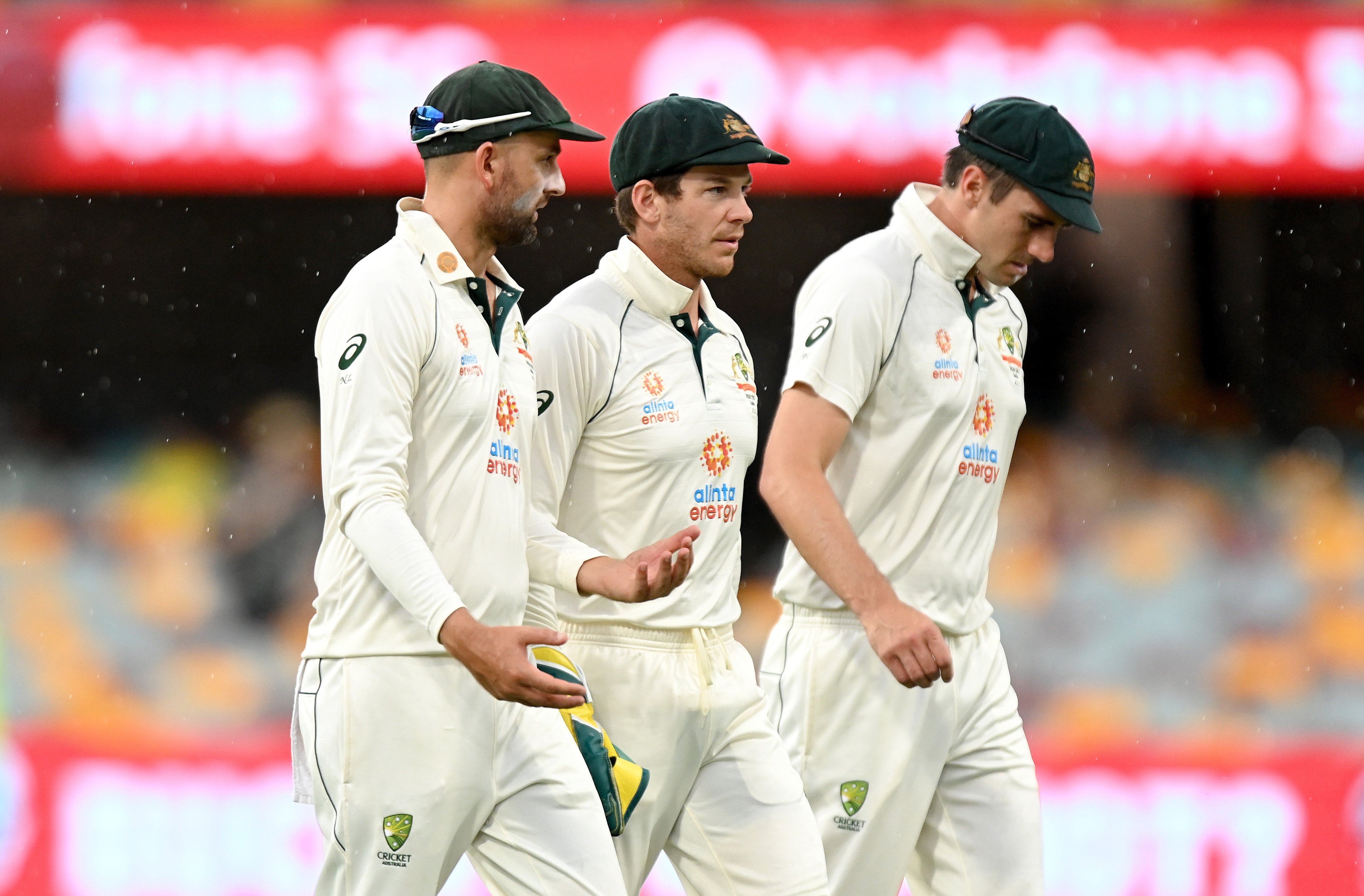 Tim Paine, Nathan Lyon and Pat Cummins of Australia.