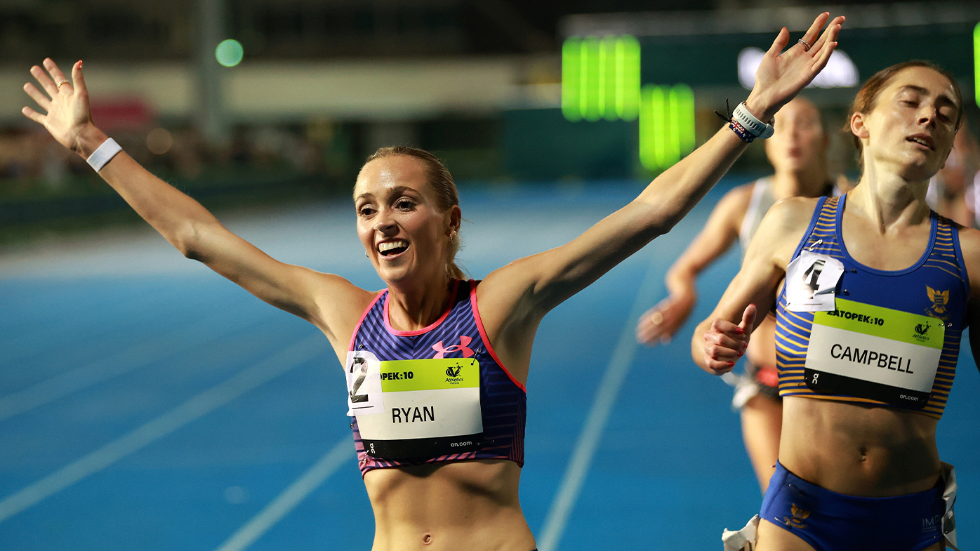 Lauren Ryan celebrates victory her Australian women's 10,000m title victory in Melbourne.