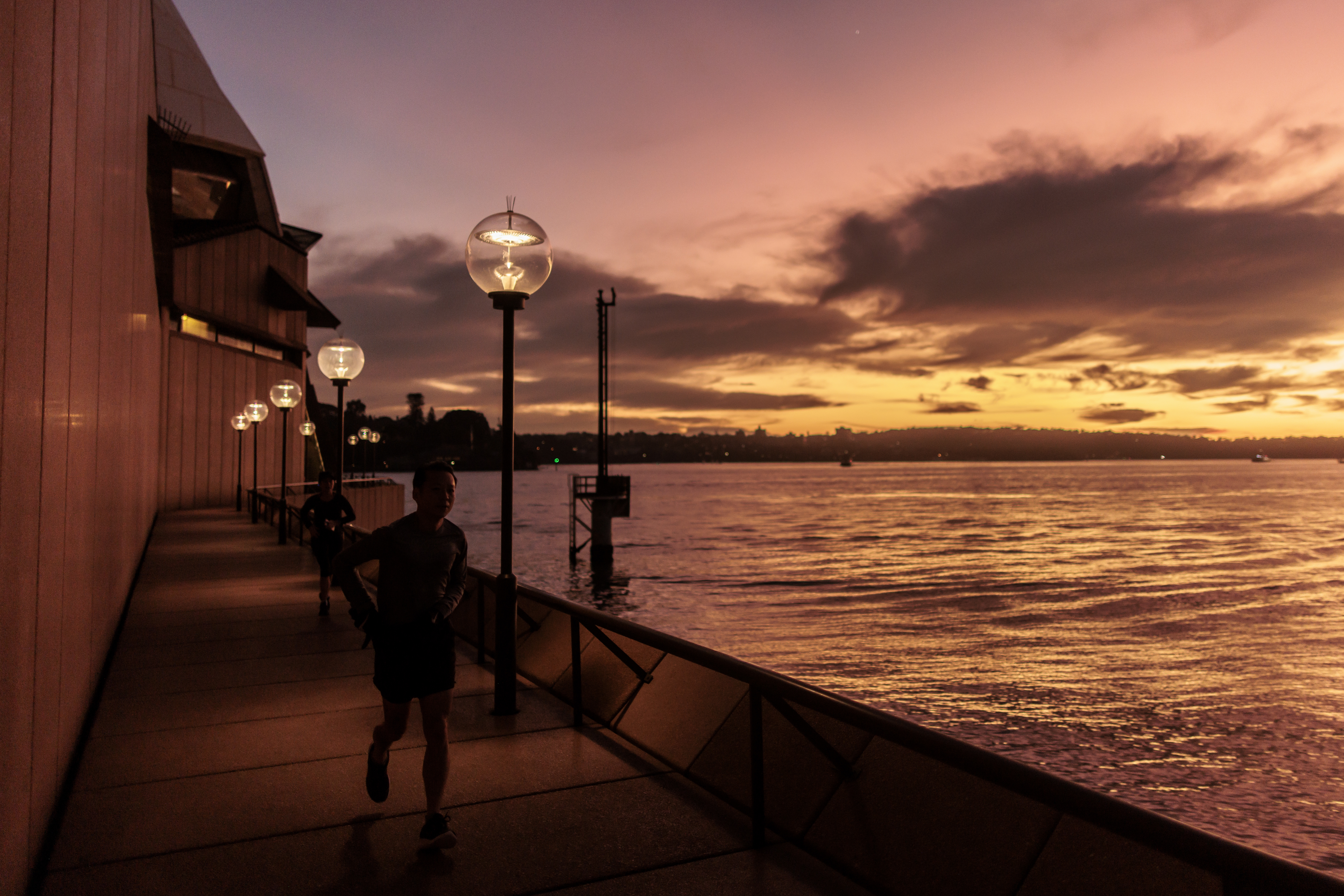 Dawn on the Harbour on the Winter Solstice as the afterglow caused by a Volcanic eruption in Tonga continues on 21 June 2022.