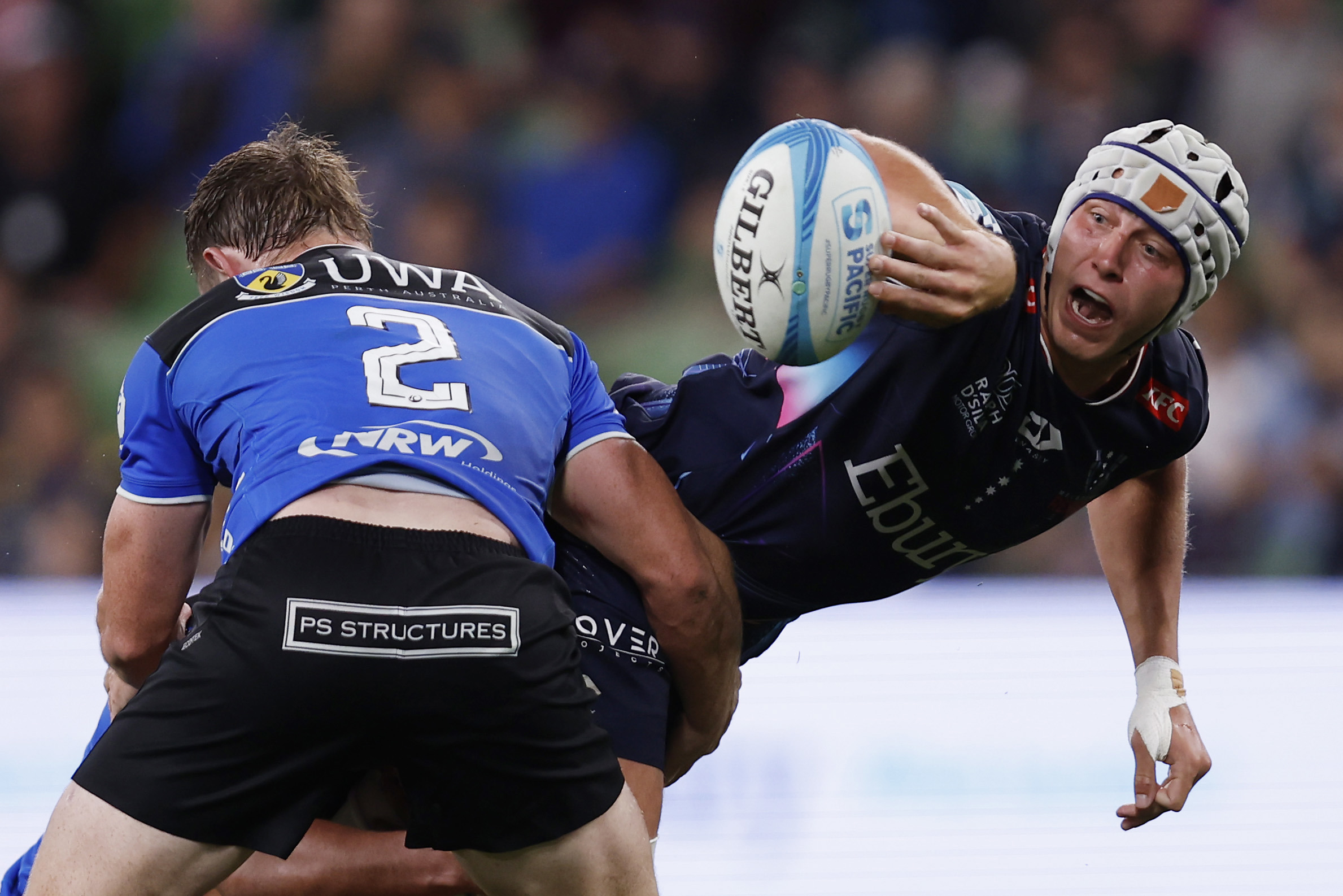 Josh Canham of the Rebels passes the ball during the round two Super Rugby Pacific match between Melbourne Rebels and Western Force at AAMI Park.