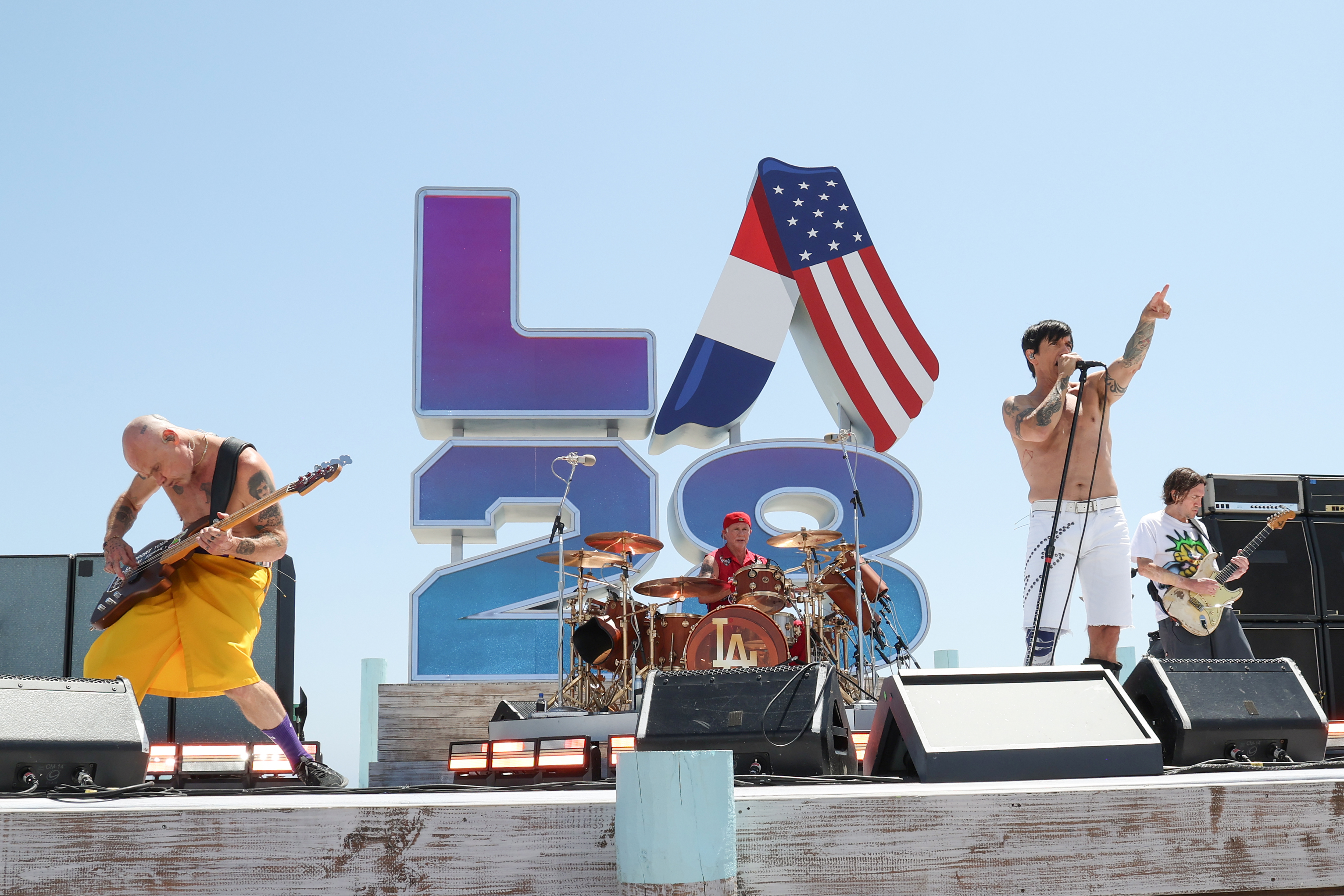 Flea, Chad Smith, Anthony Kiedis, and John Frusciante of Red Hot Chili Peppers perform at the LA28 Olympic Handover Celebration. 