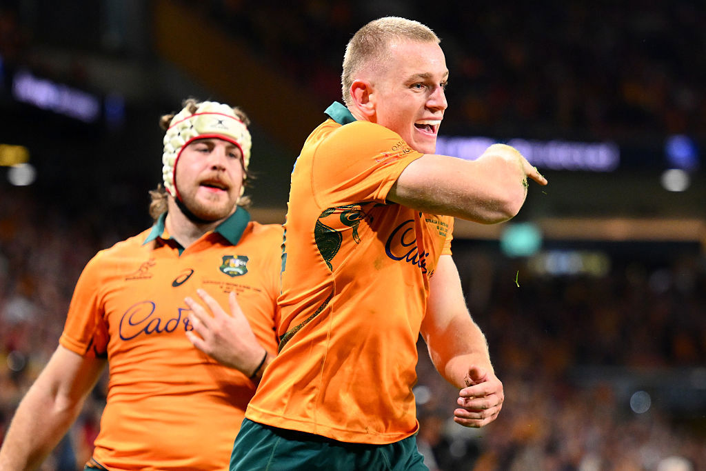 Max Jorgensen of the Wallabies celebrates scoring a try.