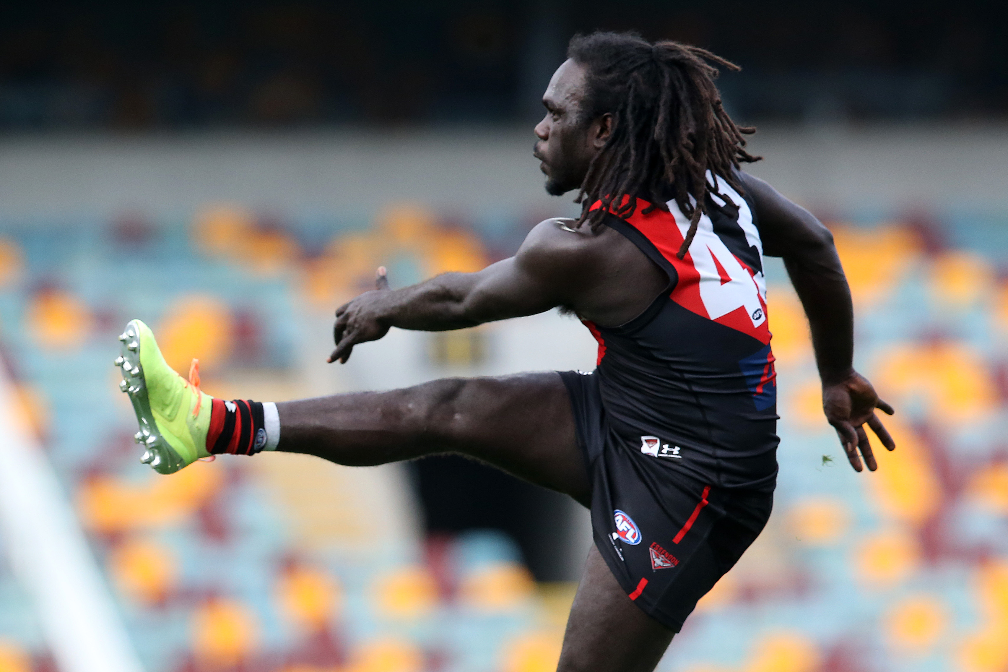 Essendon's Anthony McDonald-Tipungwuti kicks the ball.