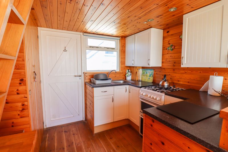 Charming beach hut in Dorset, England, on offer for $791k comes without a toilet or shower.