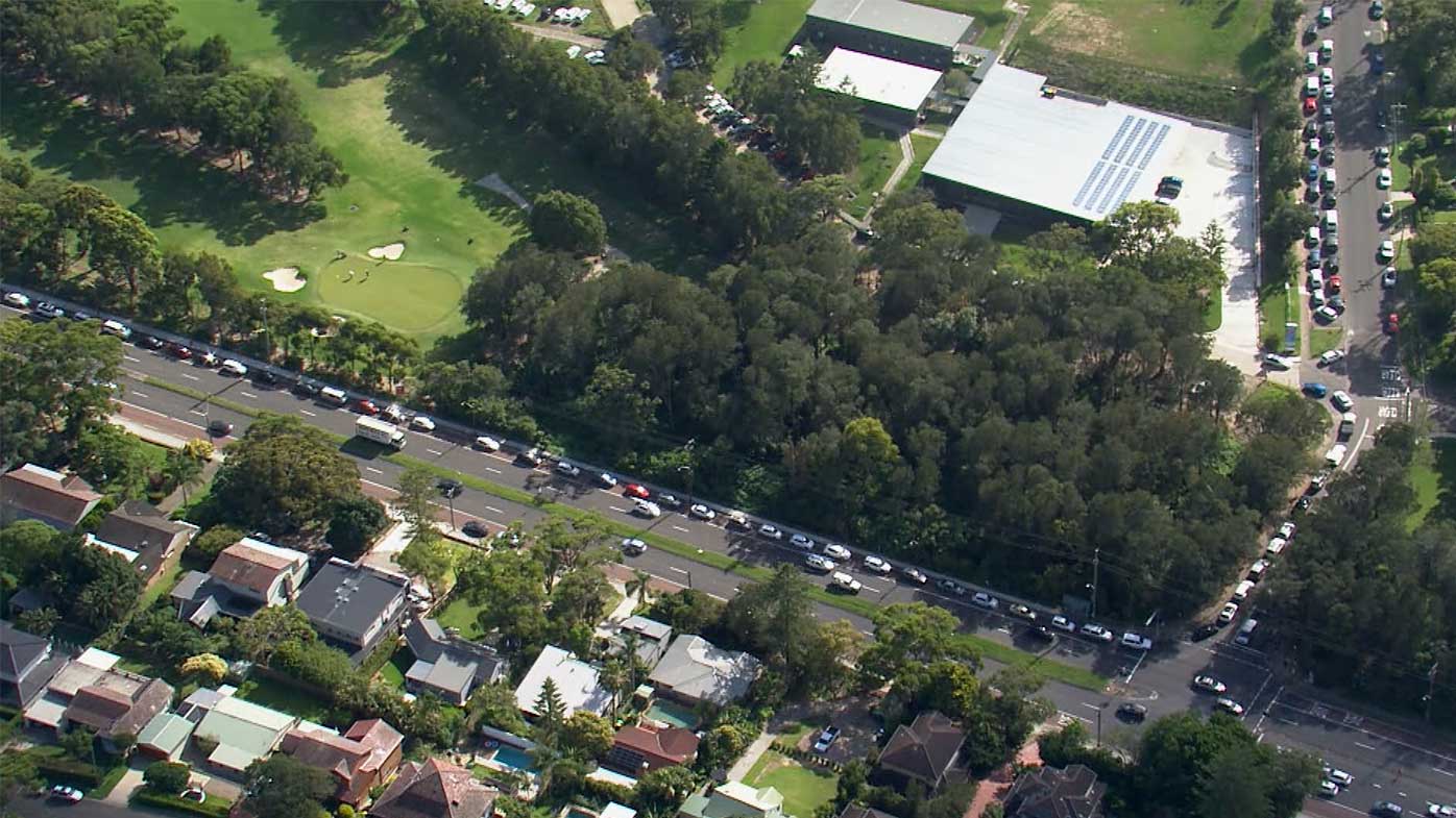 Long lines of cars wait for PCR tests in Mona Vale, Sydney.