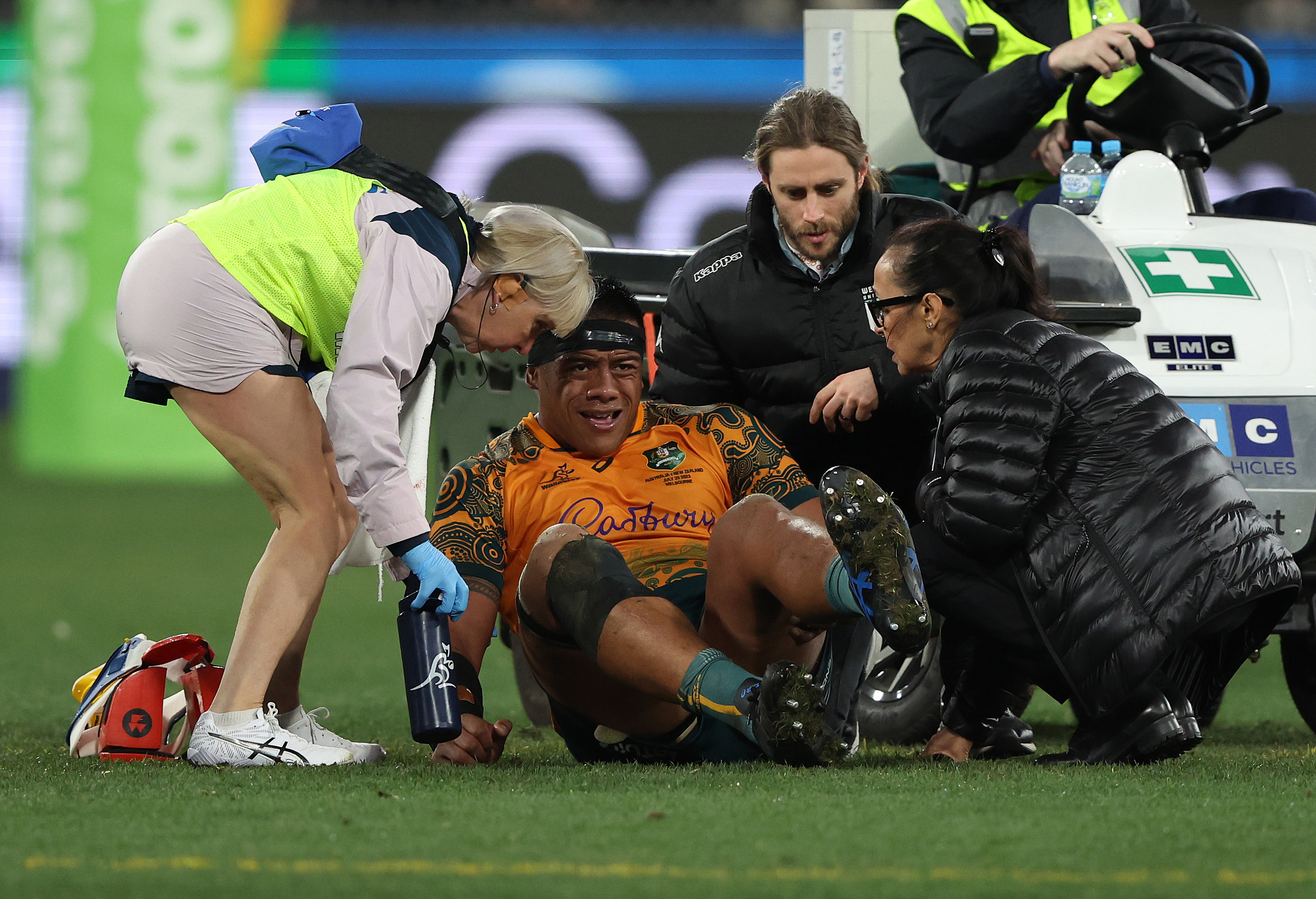 Allan Alaalatoa of the Wallabies comes off the ground with an injury.