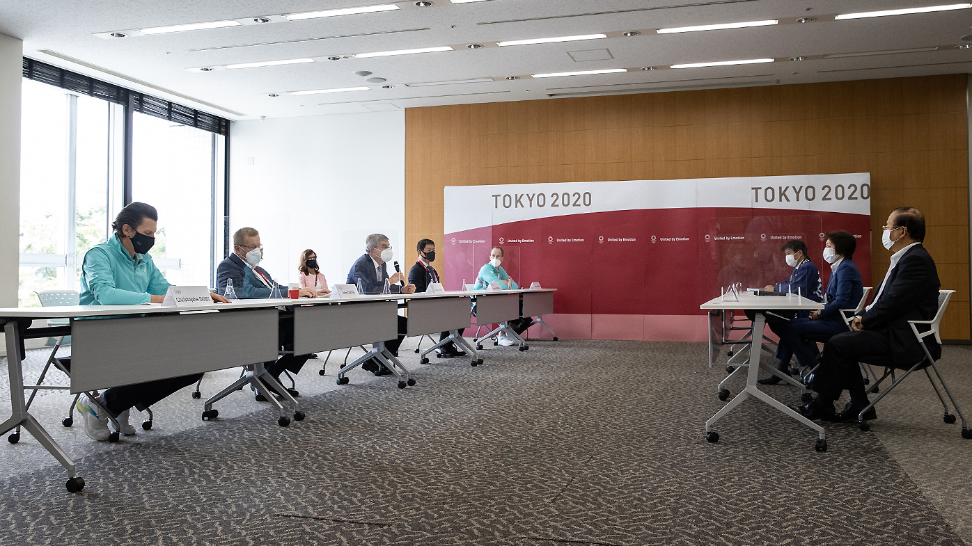 President Thomas Bach (4L) speaks to Tokyo 2020 President Seiko Hashimoto (2R) during their meeting at the Tokyo 2020 Headquarters on