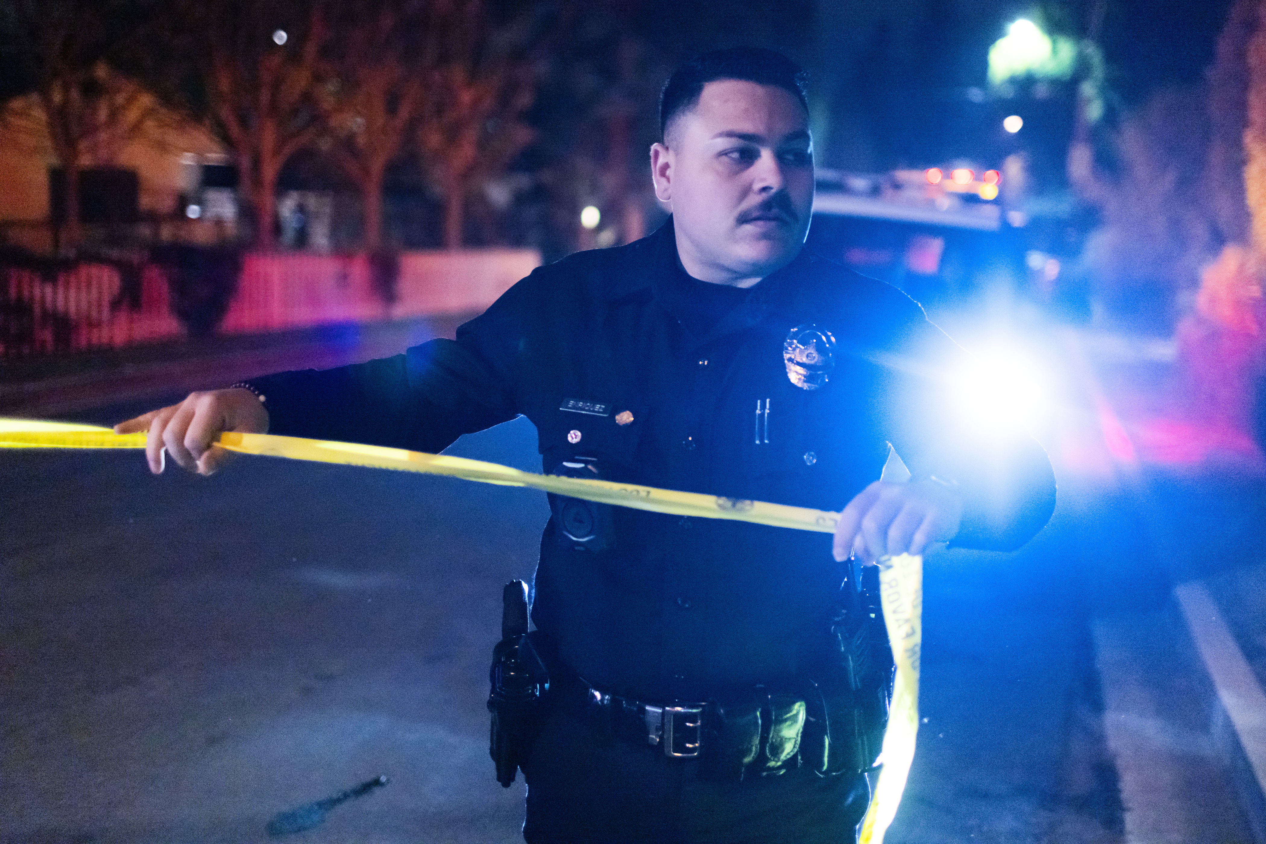 A police officer blocks off a street near Rob Reiner's residence Sunday, Dec. 14, 2025, in the Brentwood section of Los Angeles. (AP Photo/Ethan Swope)