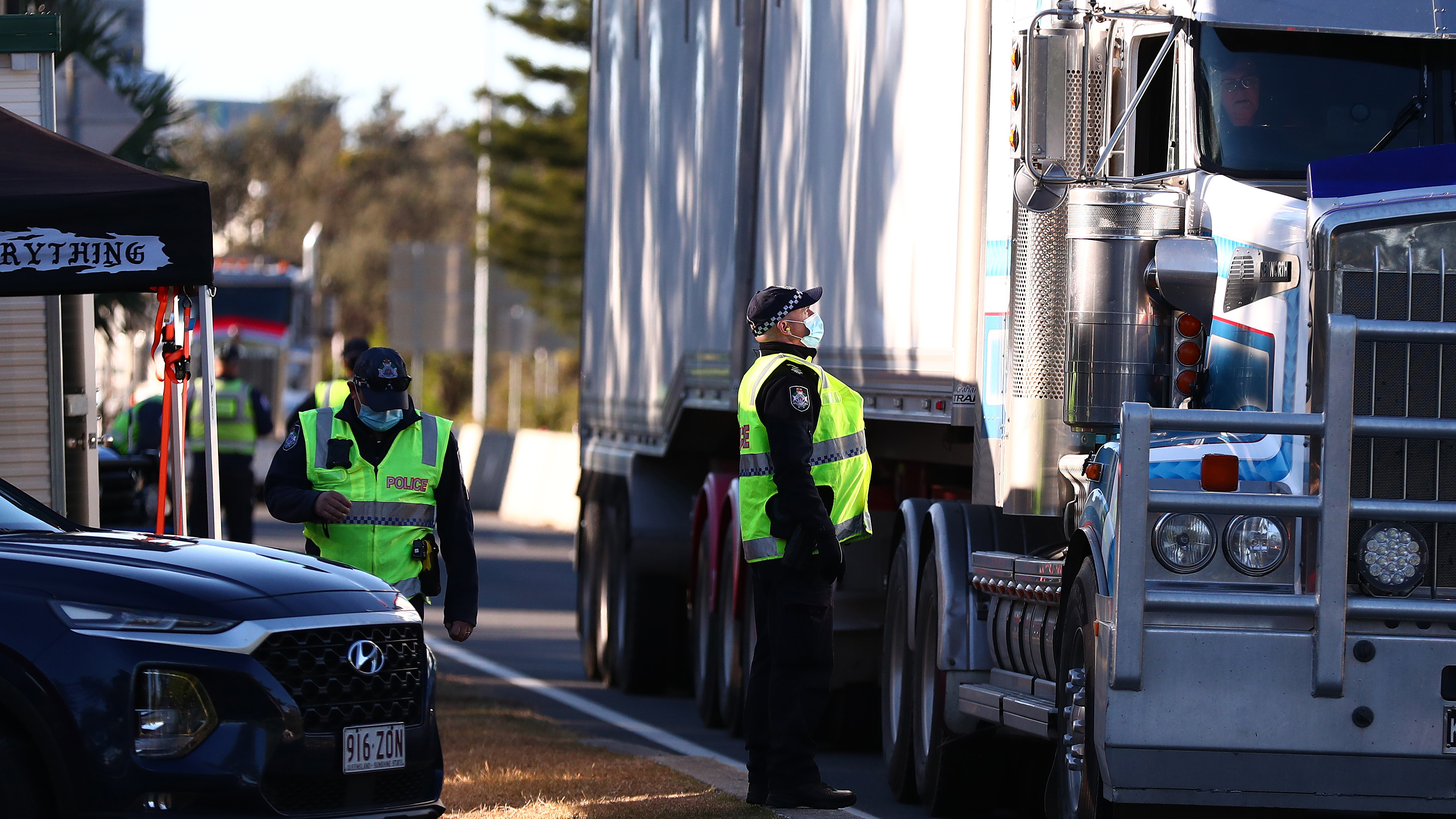 Queensland Police stop trucks at the Queensland border in Coolangatta.