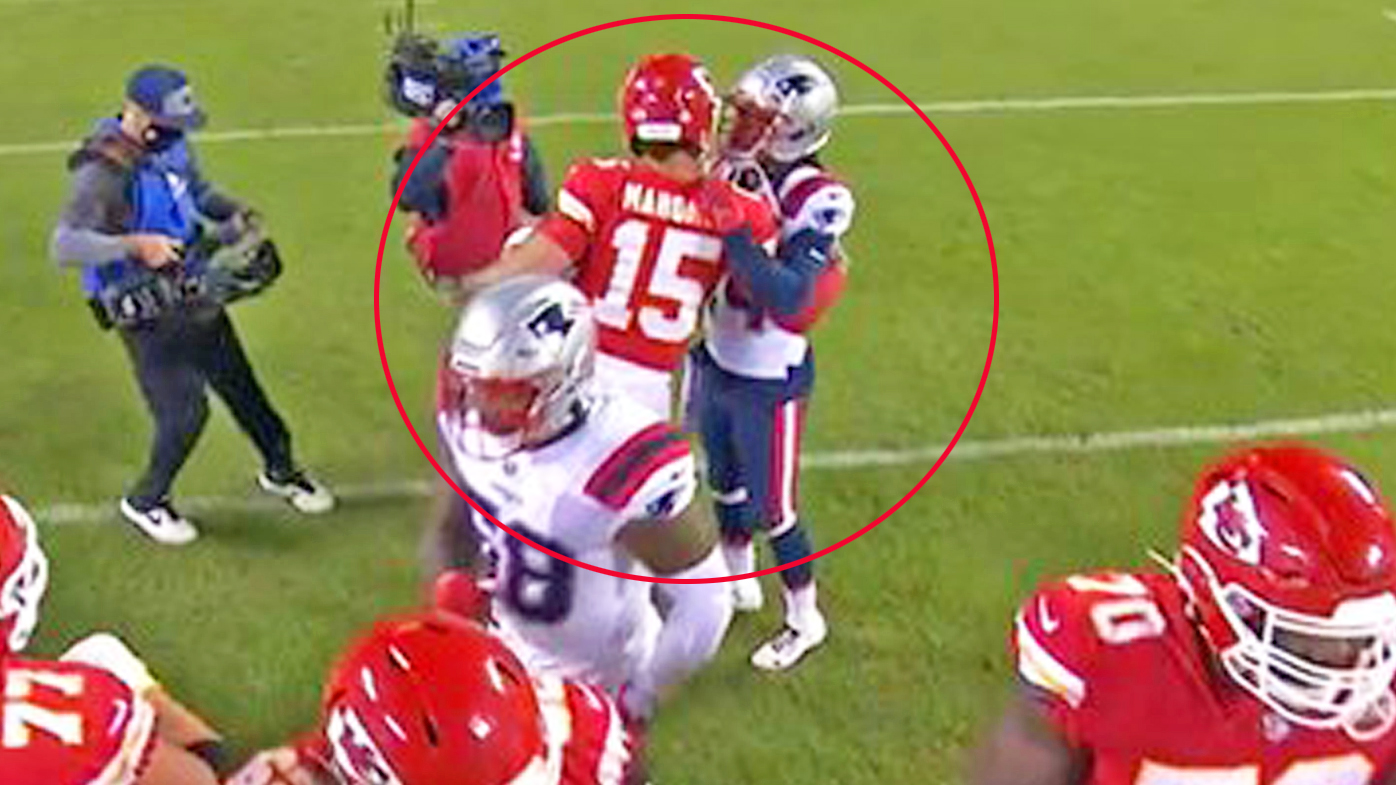 Gilmore and Mahomes embrace after the Chiefs' win over the Patriots in the NFL