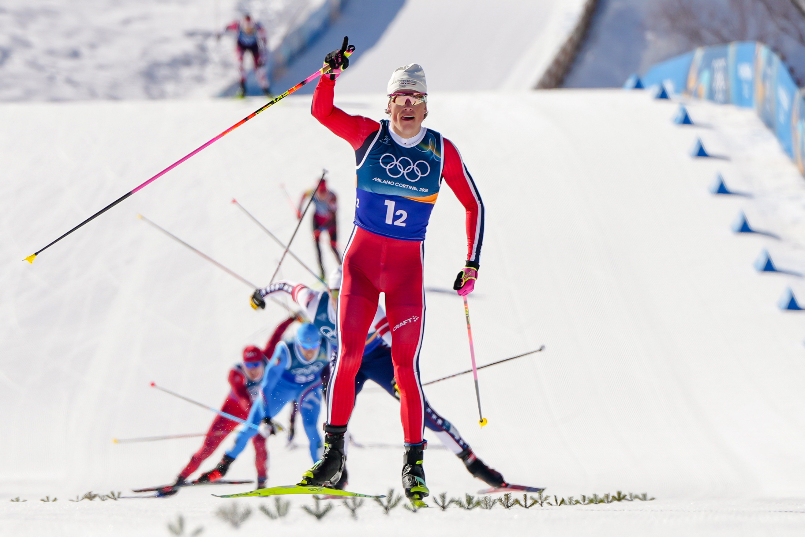 Johannes Hoesflot Klaebo, of Norway, approaches the finish line to win the gold medal in the cross-country skiing men's team sprint free at the 2026 Winter Olympics, in Tesero, Italy, Wednesday, Feb. 18, 2026. (AP Photo/Kirsty Wigglesworth)