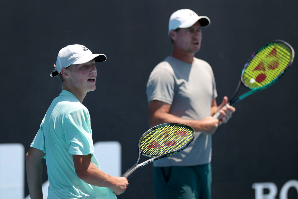 Lleyton and Cruz Hewitt play doubles during an Alex de Minaur training session.