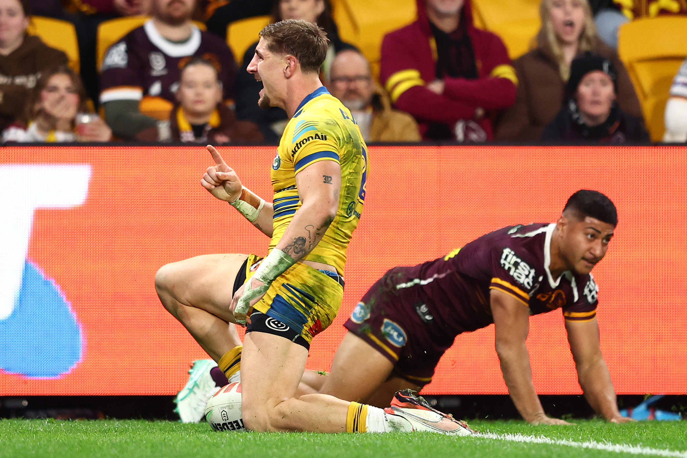 BRISBANE, AUSTRALIA - JULY 25: Zac Lomax of the Eels celebrates a try during the round 21 NRL match between Broncos and Eels at Suncorp Stadium, on July 25, 2025, in Brisbane, Australia. (Photo by Chris Hyde/Getty Images)
