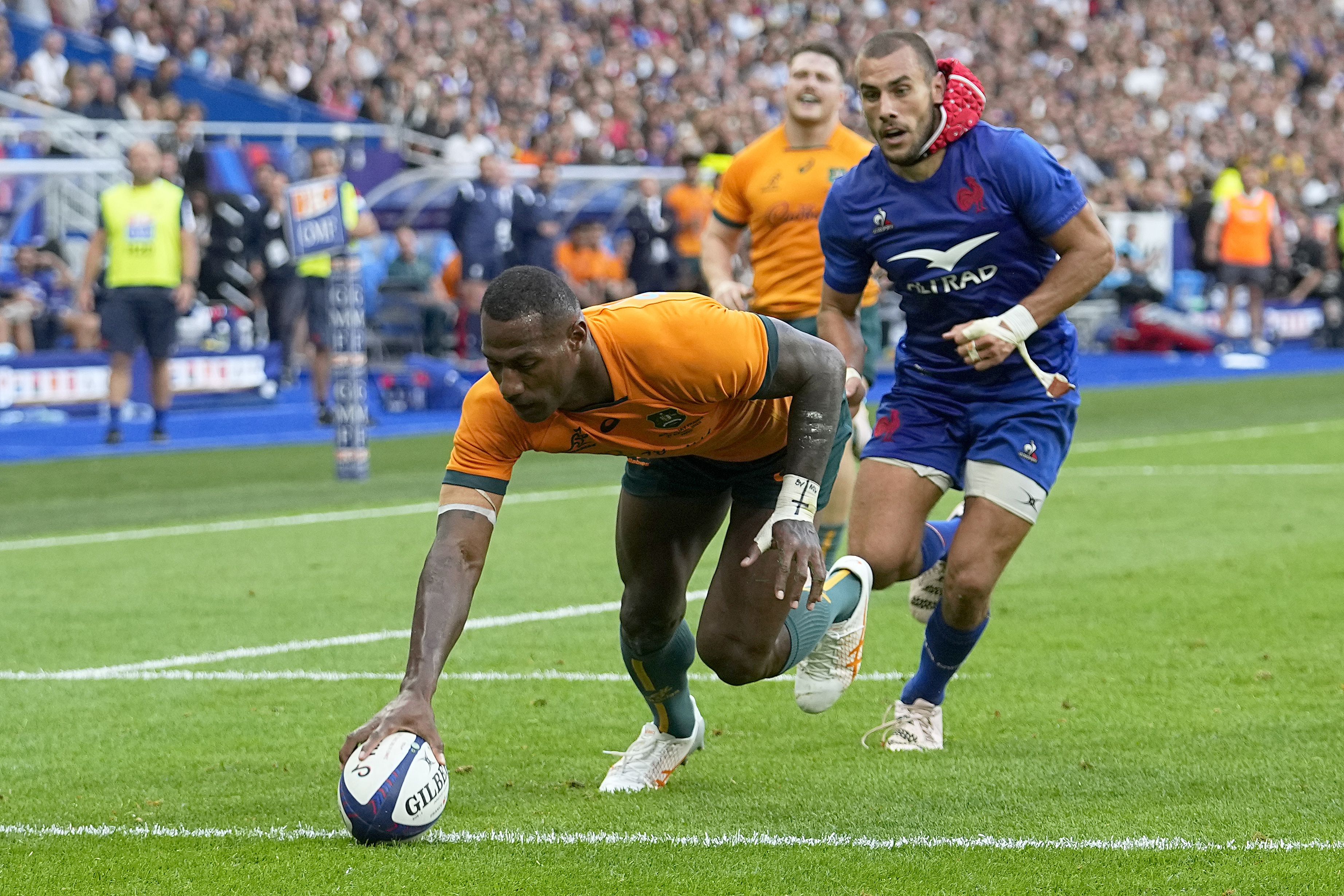 Australia's Suliasi Vunivalu scores a try during a Rugby World Cup warm-up against France.