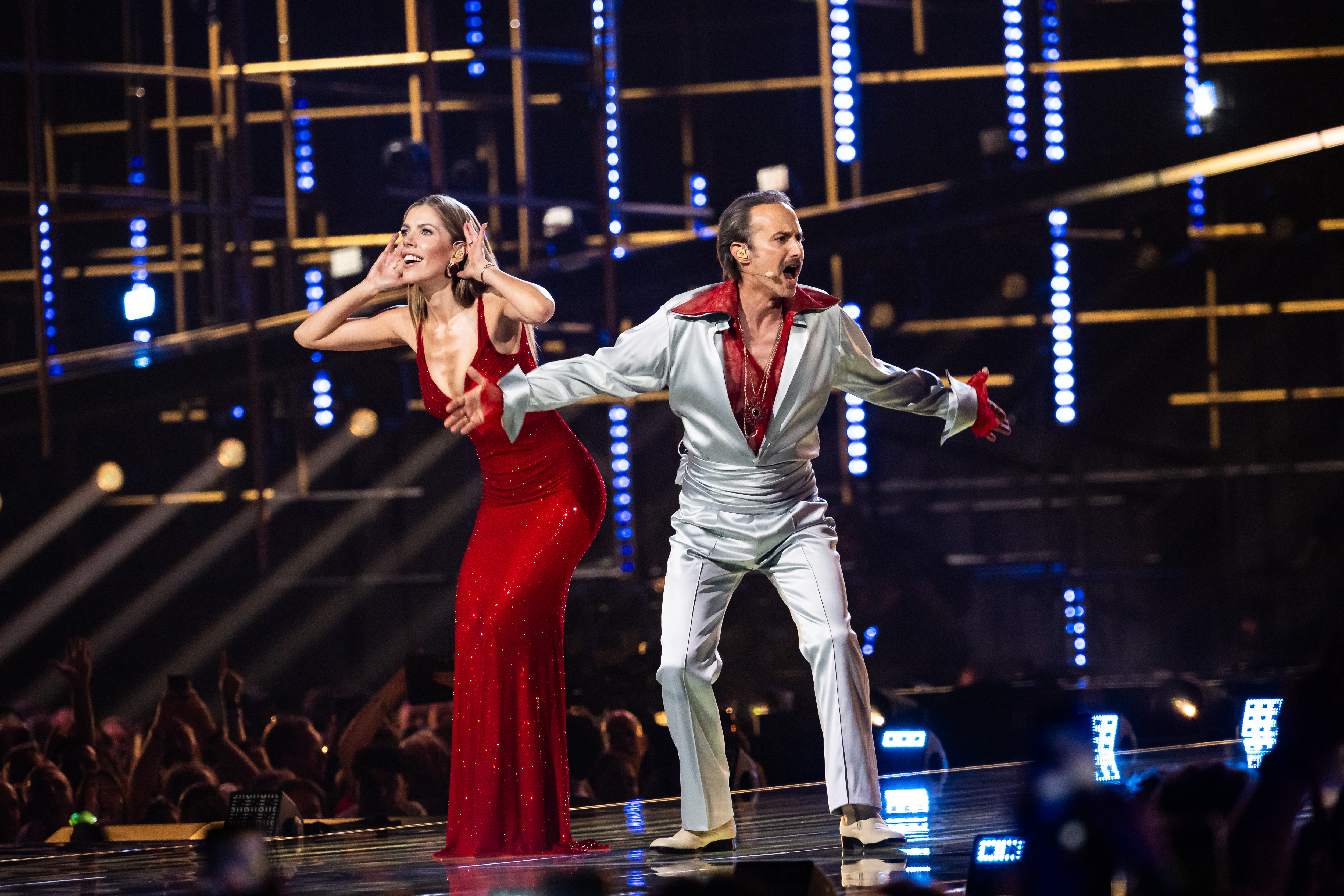  Victoria Swarovski and Michael Ostrowski speak onstage during the second dress rehearsal for the semi-final 1 of the 2026 Eurovision Song Contest at Wiener Stadthalle on May 11, 2026 in Vienna, Austria.  (Photo by Christian Bruna/Getty Images)