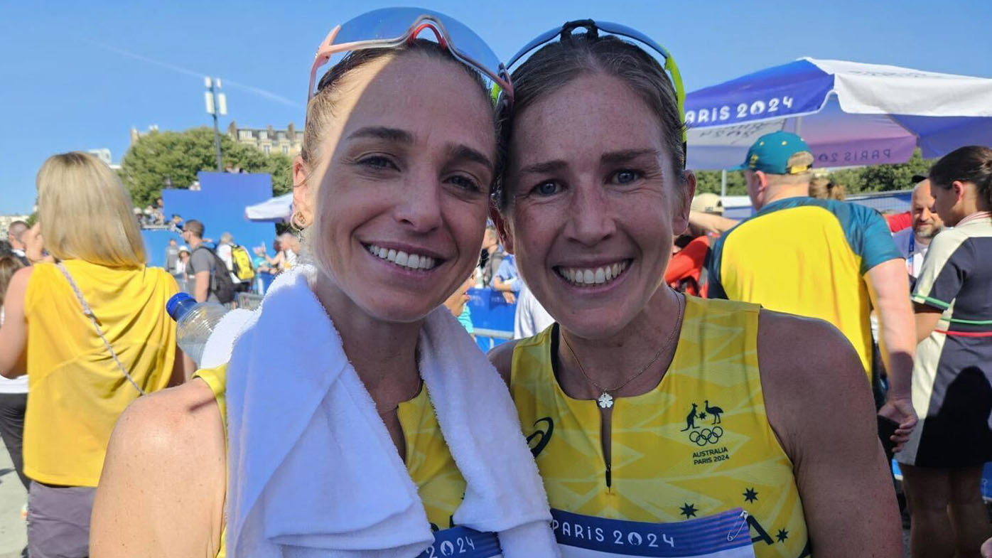 Genevieve Gregson (left) and Jessica Stenson in the media mixed zone after completing the women's Olympic marathon.