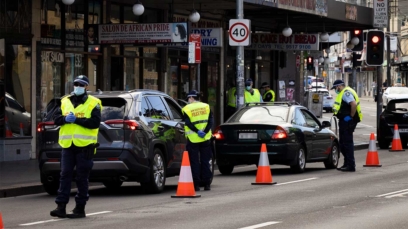 Police check drivers on Enmore Road to ensure they aren't out of the house illegally.