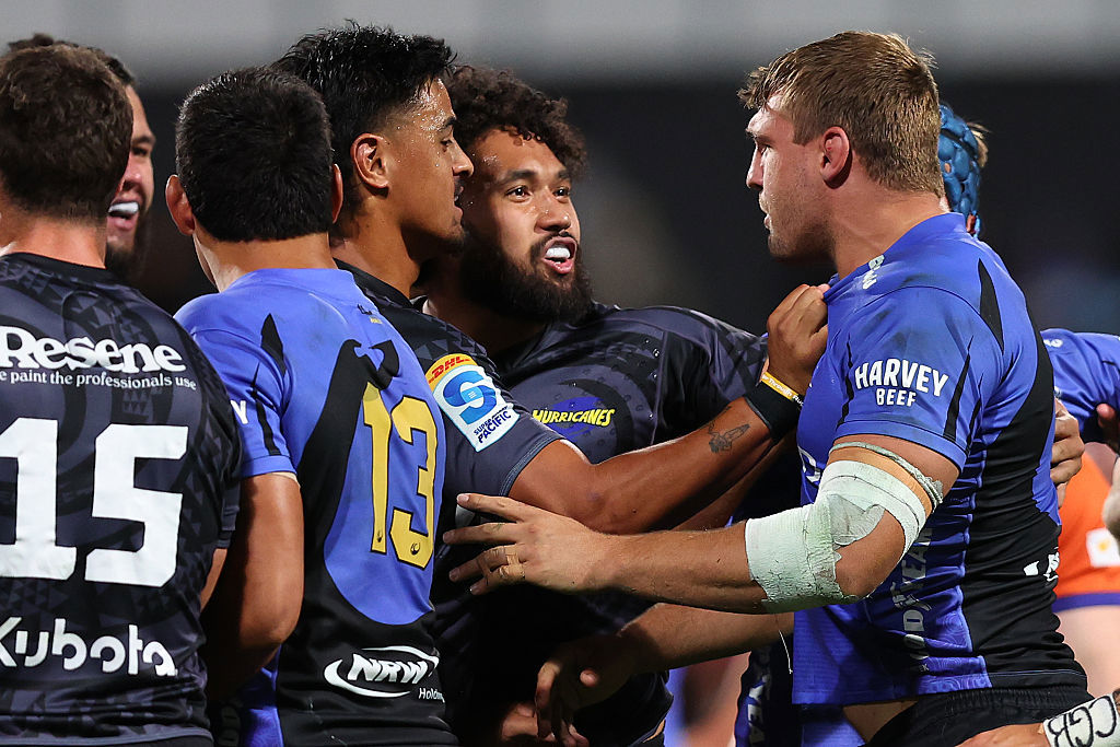 Nick Champion de Crespigny of the Force remonstrates with Hurricanes players.