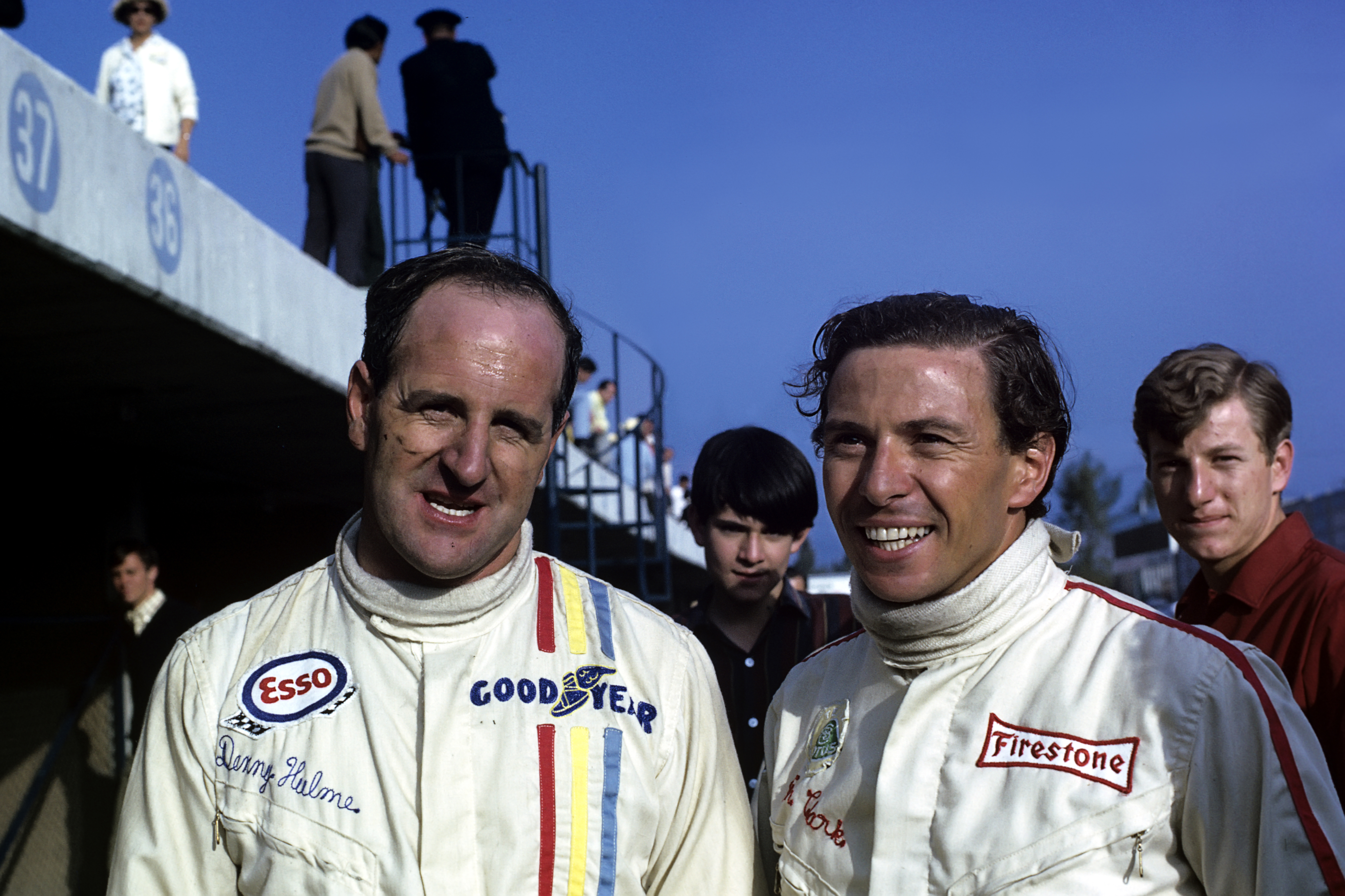 Denny Hulme (left) with Jim Clark, in 1967 at the Mexican Grand Prix.
