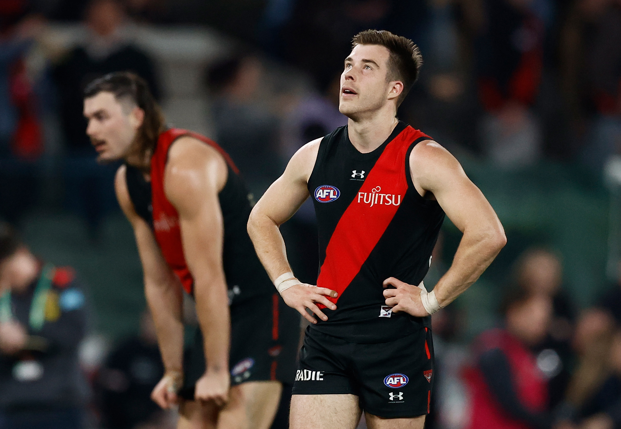 Essendon skipper Zach Merrett is dejected after the loss to Gold Coast in round 22.