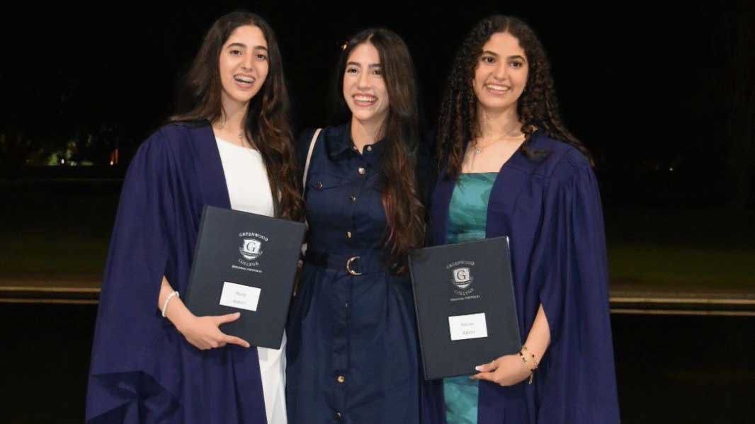 Rahma and her sisters, Mesk and Hareer, pictured at the twins' high school graduation ceremony. 